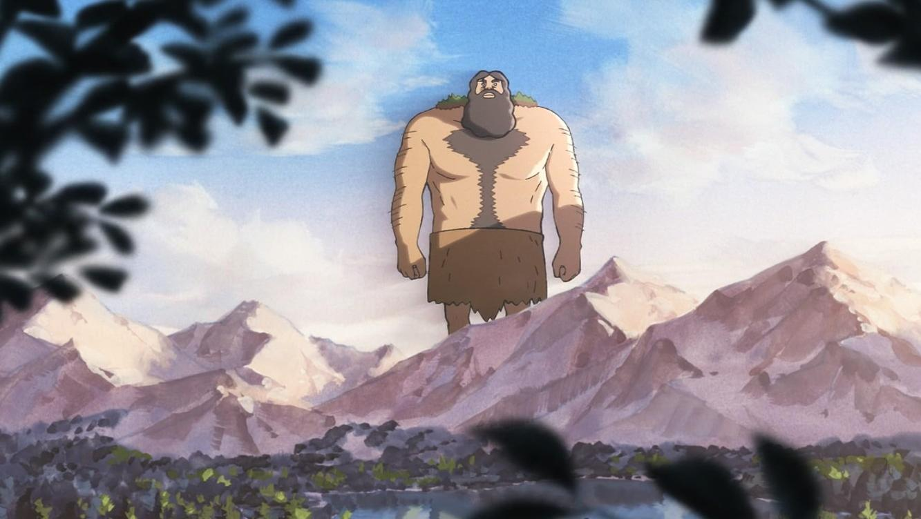 Ein riesiger Mann mit Bart steht vor schneebedeckten Bergen.