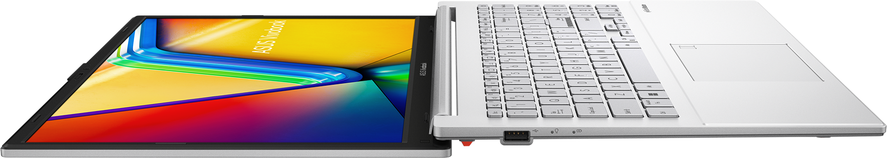 Ezüst laptop színes háttérképpel és billentyűzettel.