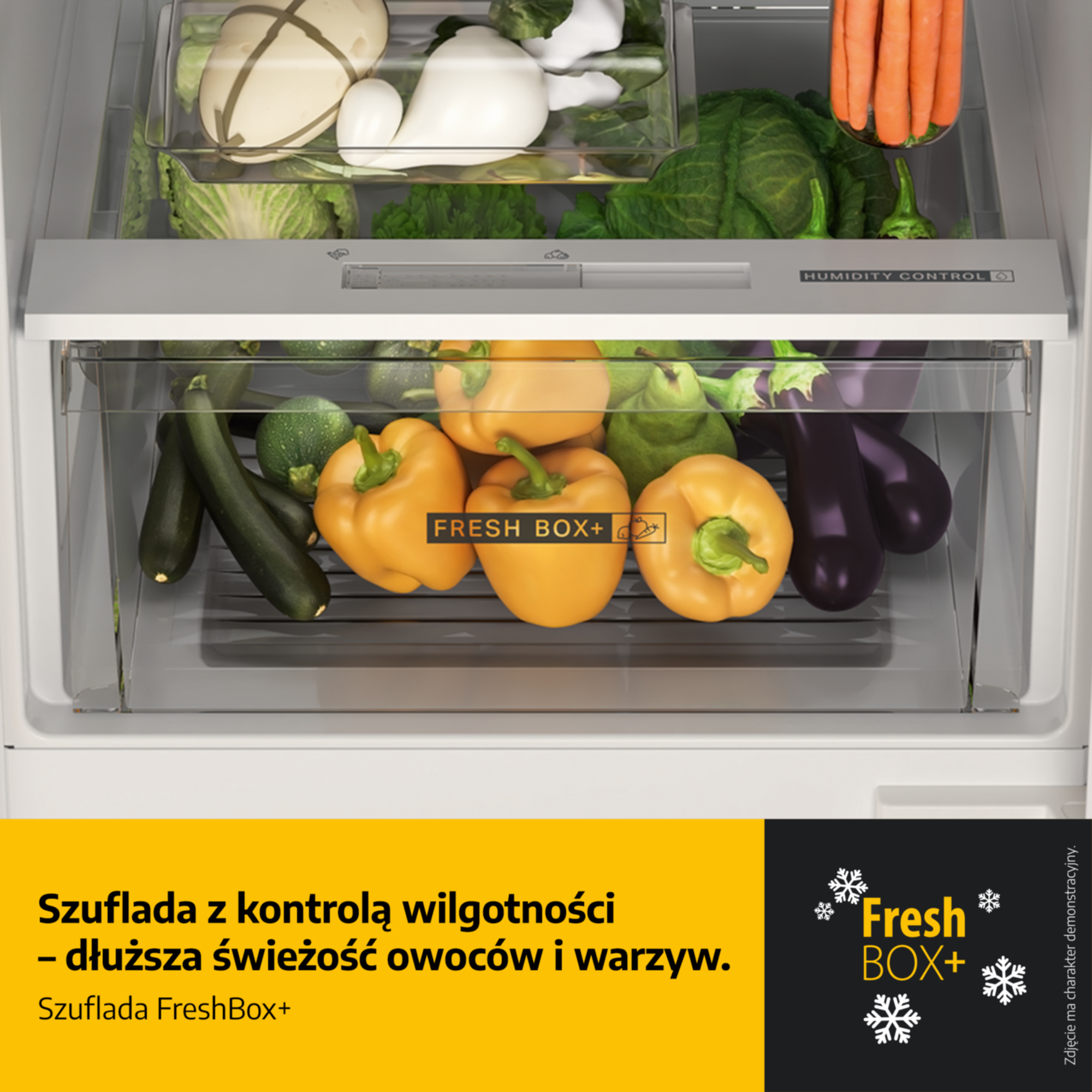 Szuflada lodówki z kontrolą wilgotności, pełna warzyw i owoców.