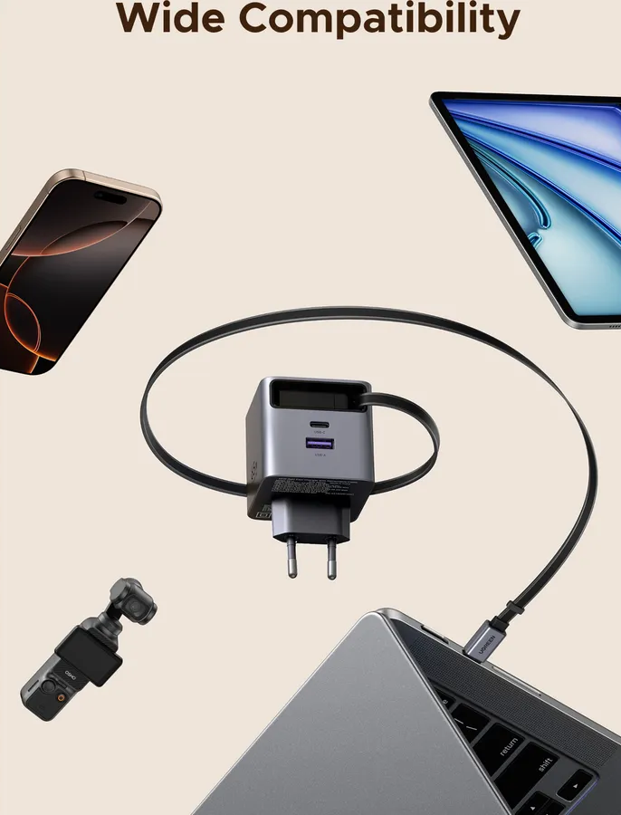 Un caricabatterie multiport carica un laptop, con telefono, tablet e fotocamera nelle vicinanze.