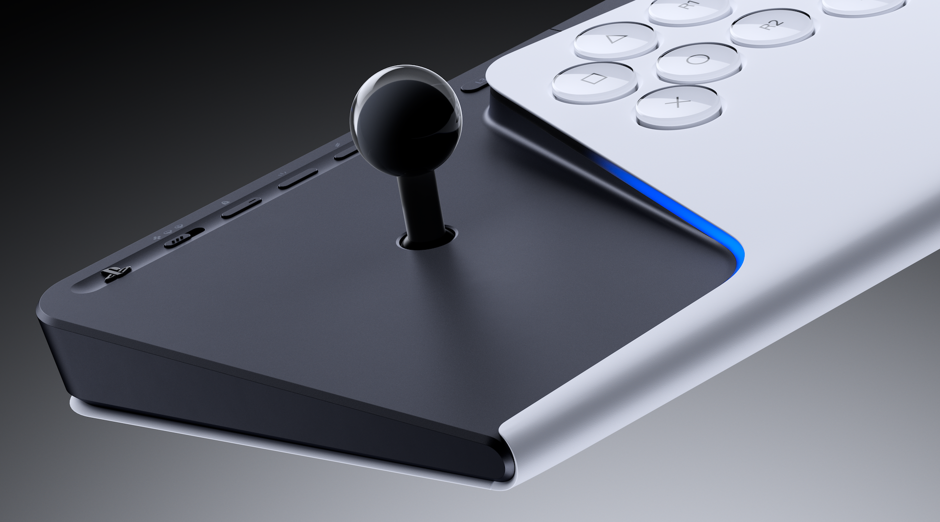 Schwarzer Joystick mit glänzender Kugel auf schwarzer Basis, neben weißem Controller mit Tasten.