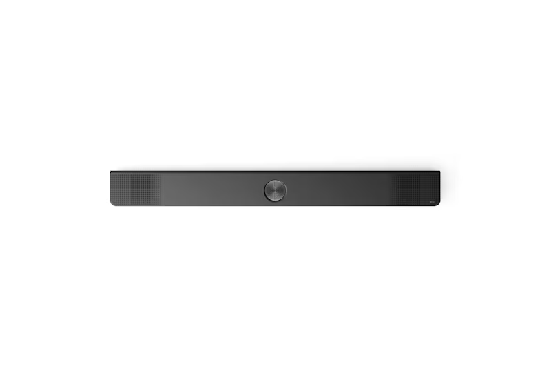 Barra de sonido negra con dial plateado en el centro, sobre fondo blanco.