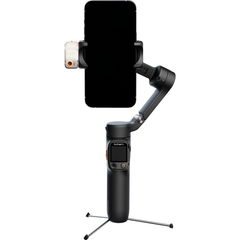 Un gimbal negro para smartphone con luz pequeña, sobre un trípode.