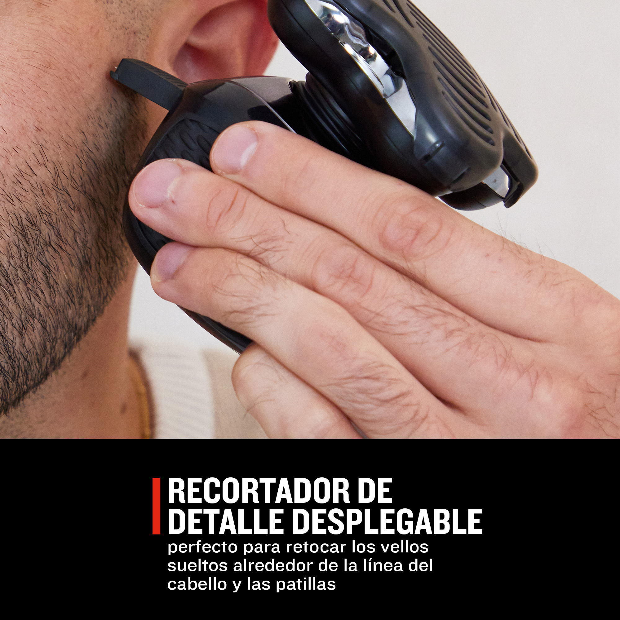 Un hombre se recorta la barba con un recortador de detalle negro. Primer plano.