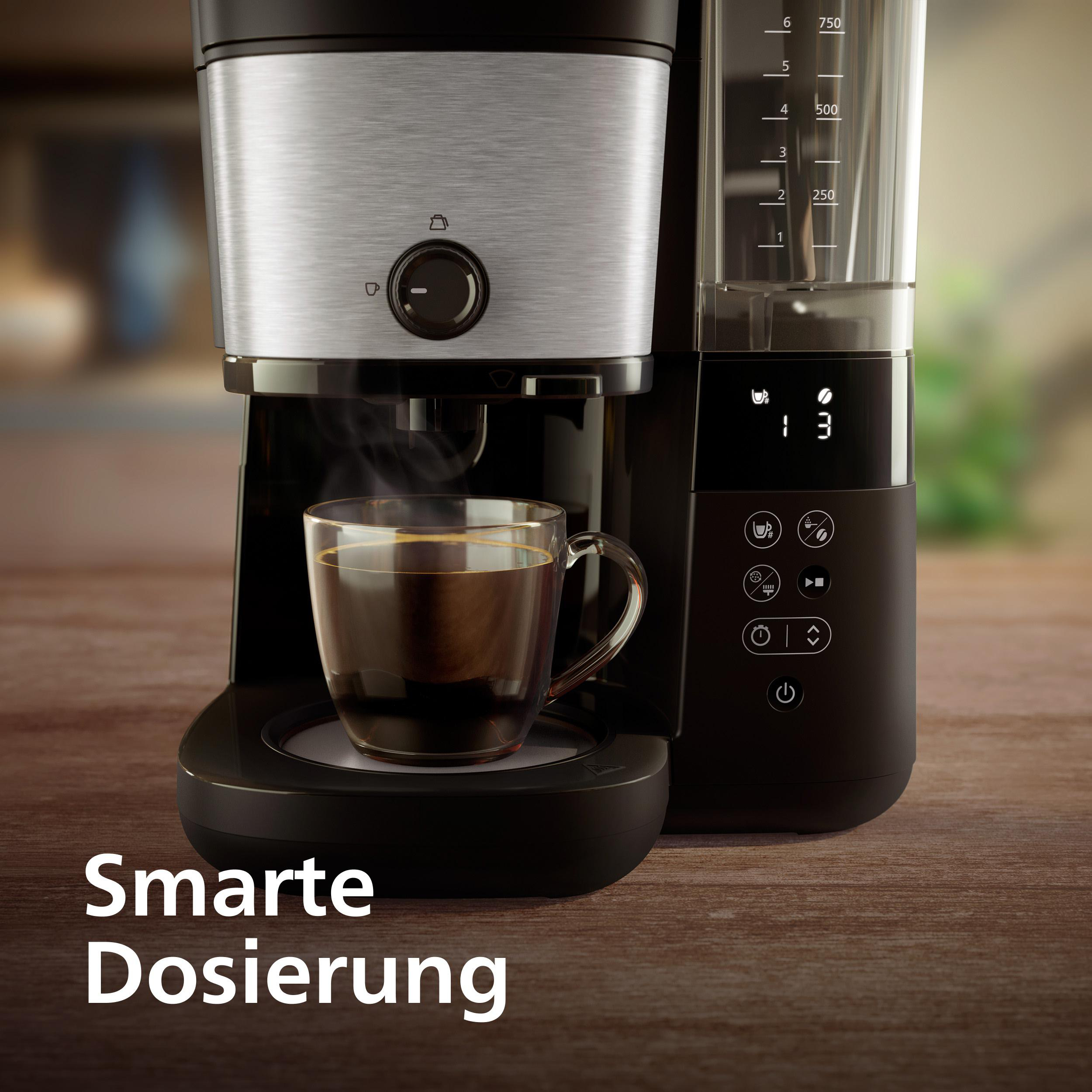 Kaffeemaschine mit Glasbecher, dampfender Kaffee, digitale Anzeige.