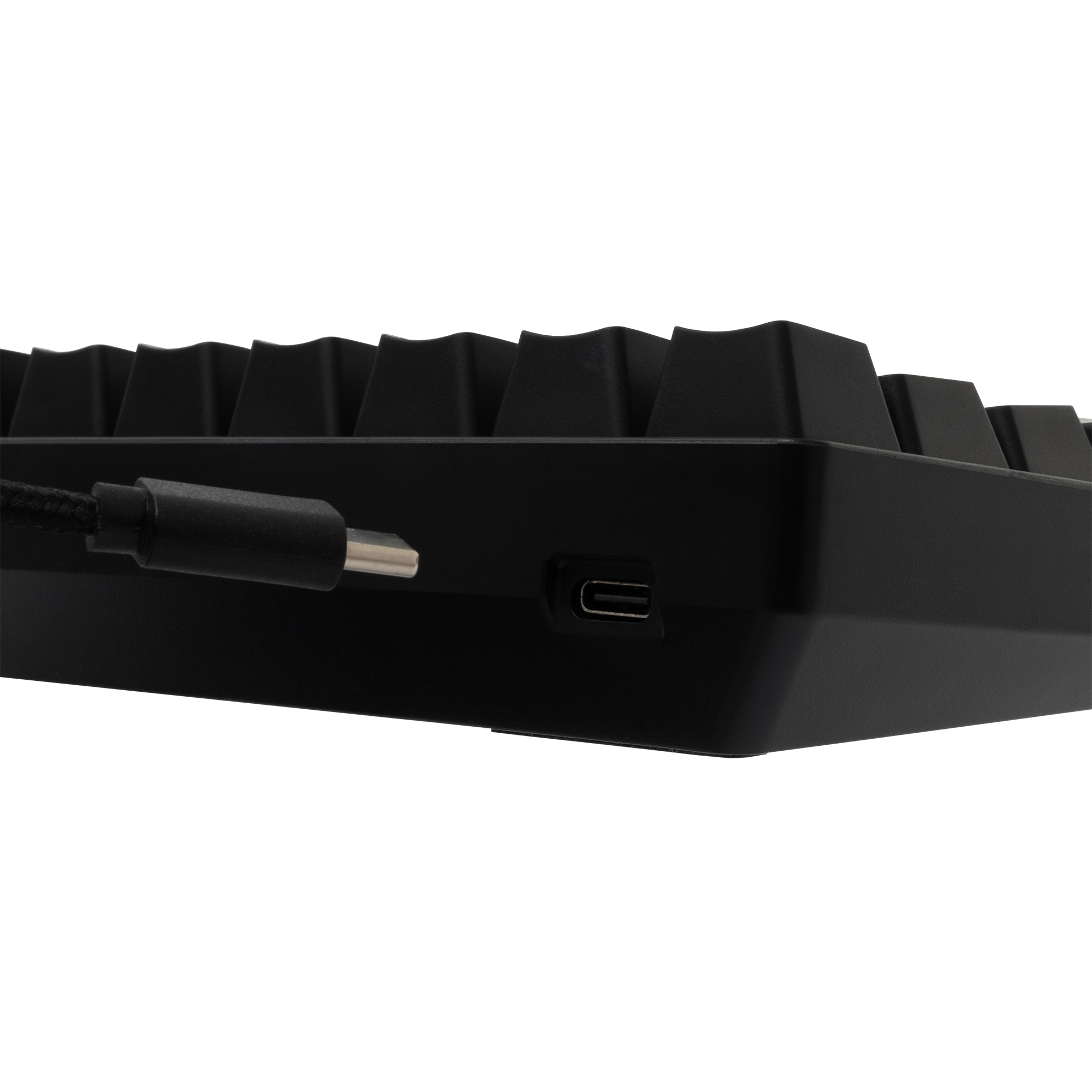 Fekete billentyűkupakok és USB-C port egy fekete billentyűzeten.