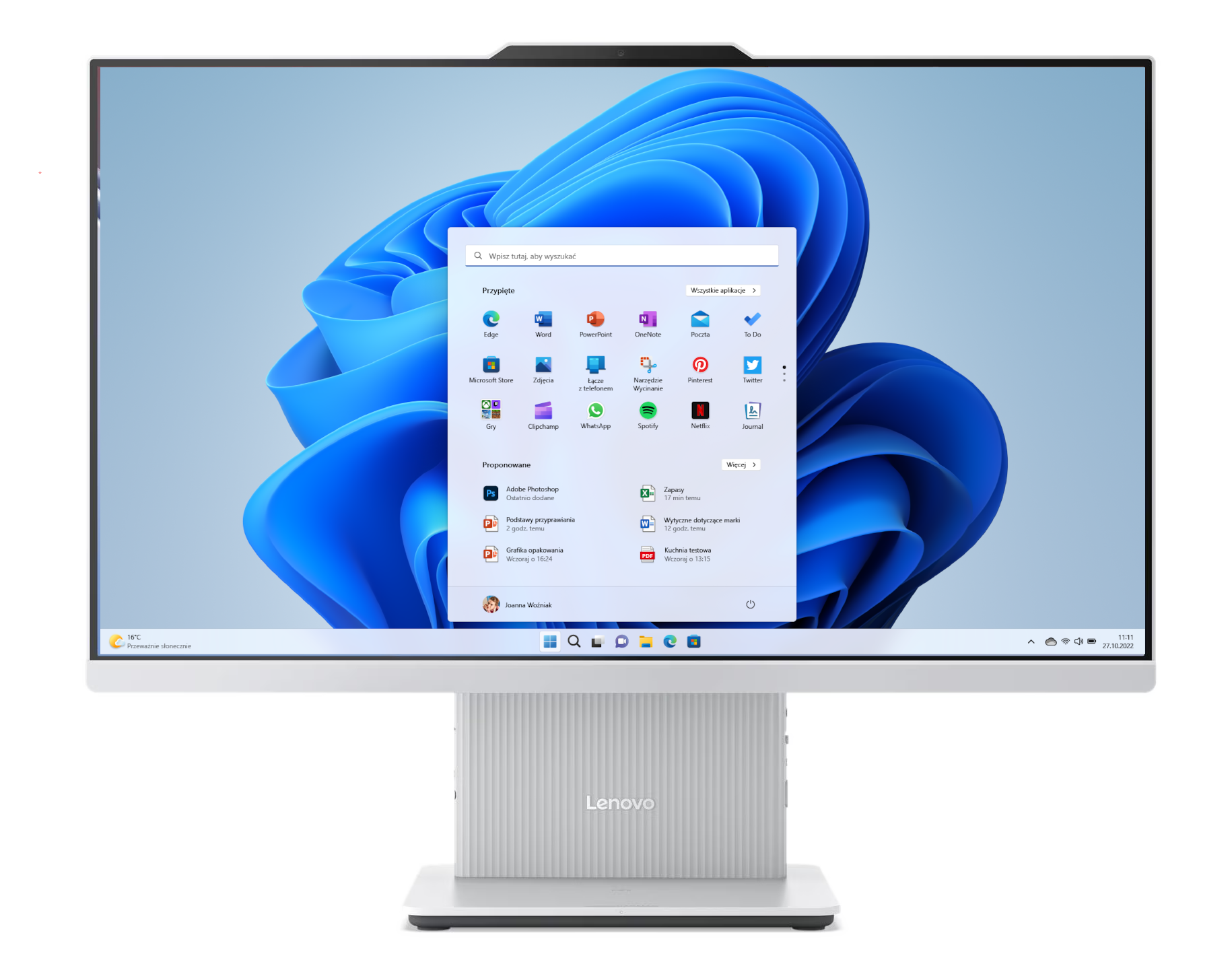 Komputer Lenovo typu all-in-one z menu Start systemu Windows 11 i niebieską tapetą.