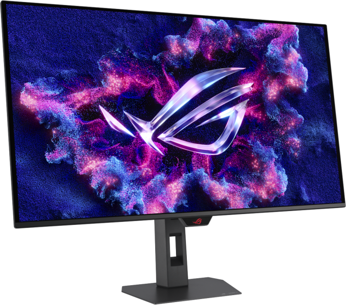 Egy gamer monitor ROG logót jelenít meg kék és rózsaszín részecskék hátterén.