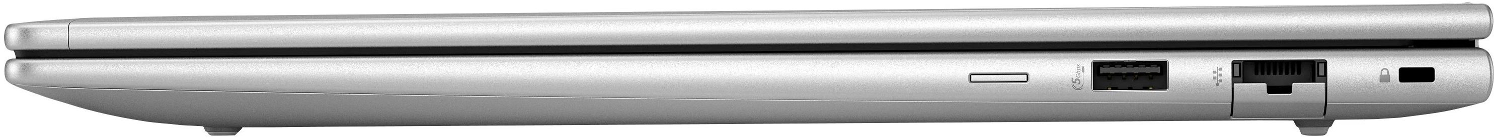 Silbernes Laptop mit USB- und Ethernet-Anschlüssen an der Seite.