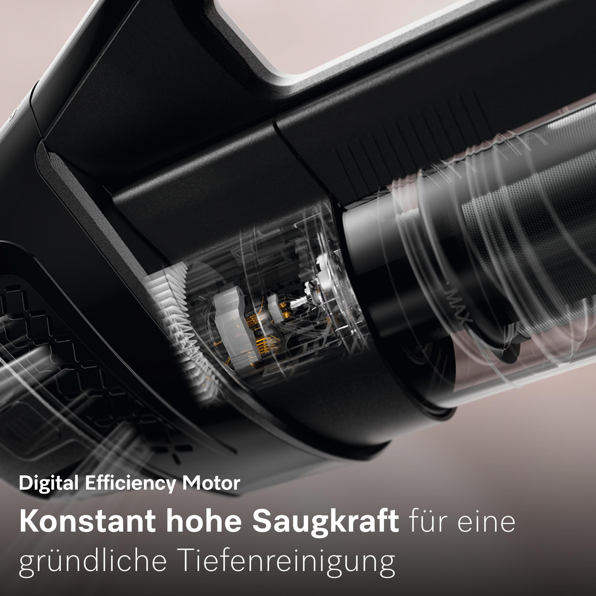 Nahaufnahme eines schwarzen Staubsaugermotors mit sichtbaren Innenteilen und Luftstrom.