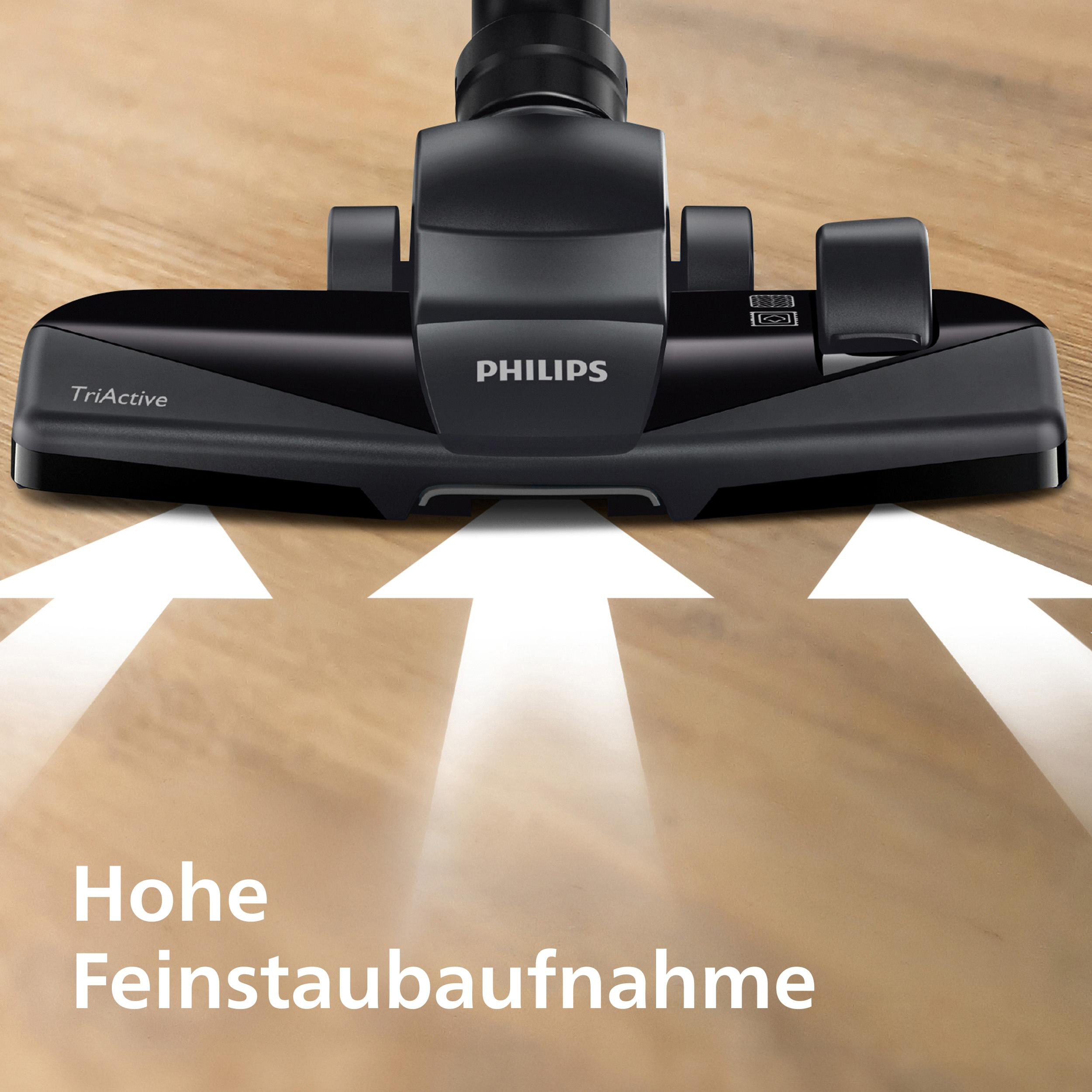 Schwarzer Philips Staubsaugerkopf mit TriActive auf Holzfußboden.
