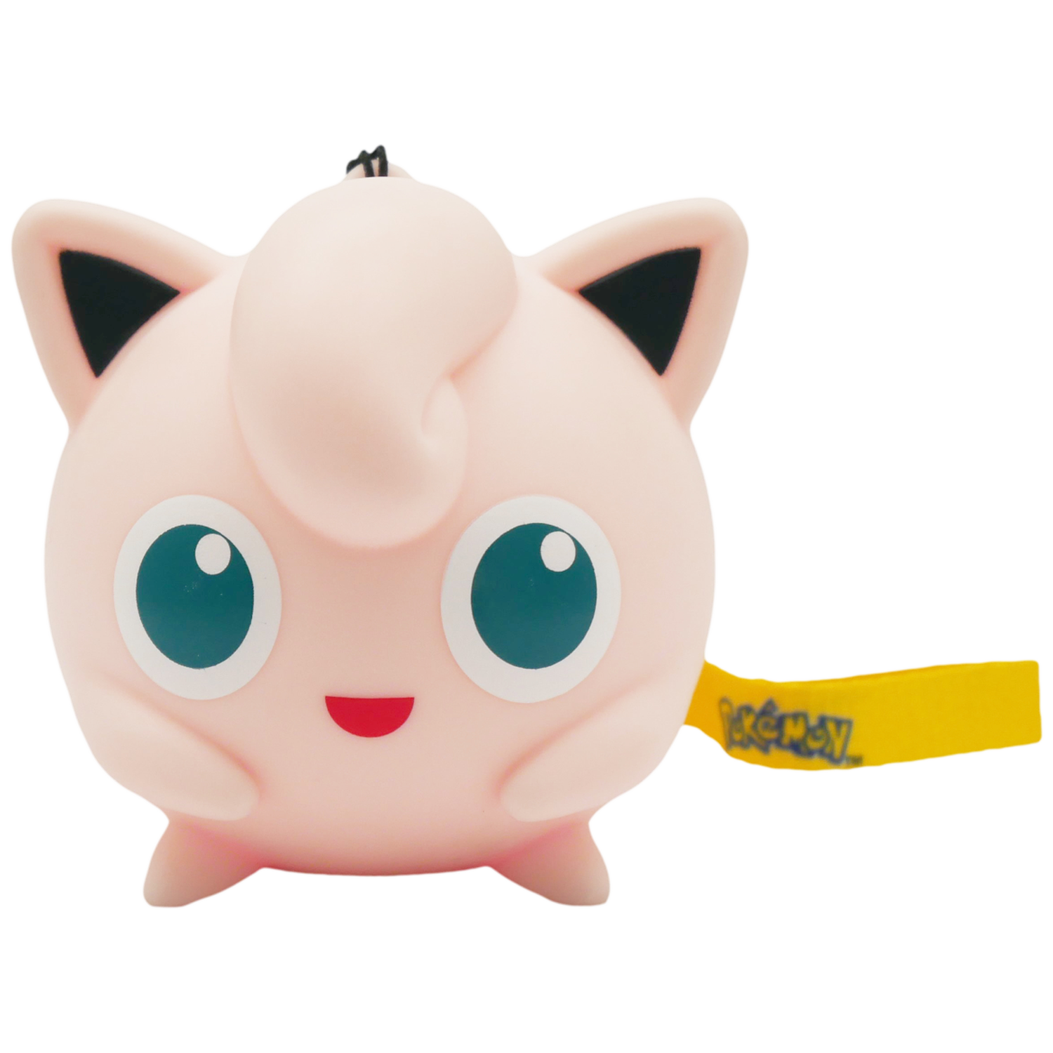 Een roze Jigglypuff Pokémon speelgoed met grote blauwe ogen en een geel Pokémon label.