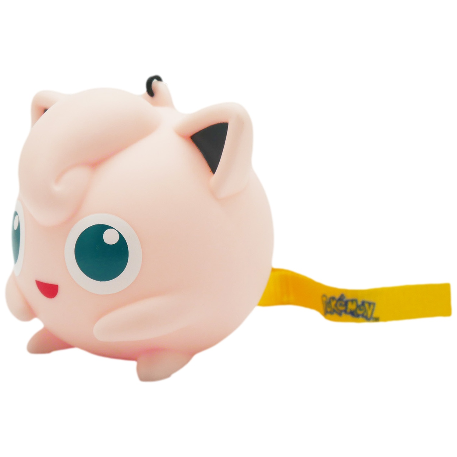 Roze Jigglypuff knuffel met grote blauwe ogen en een geel label.