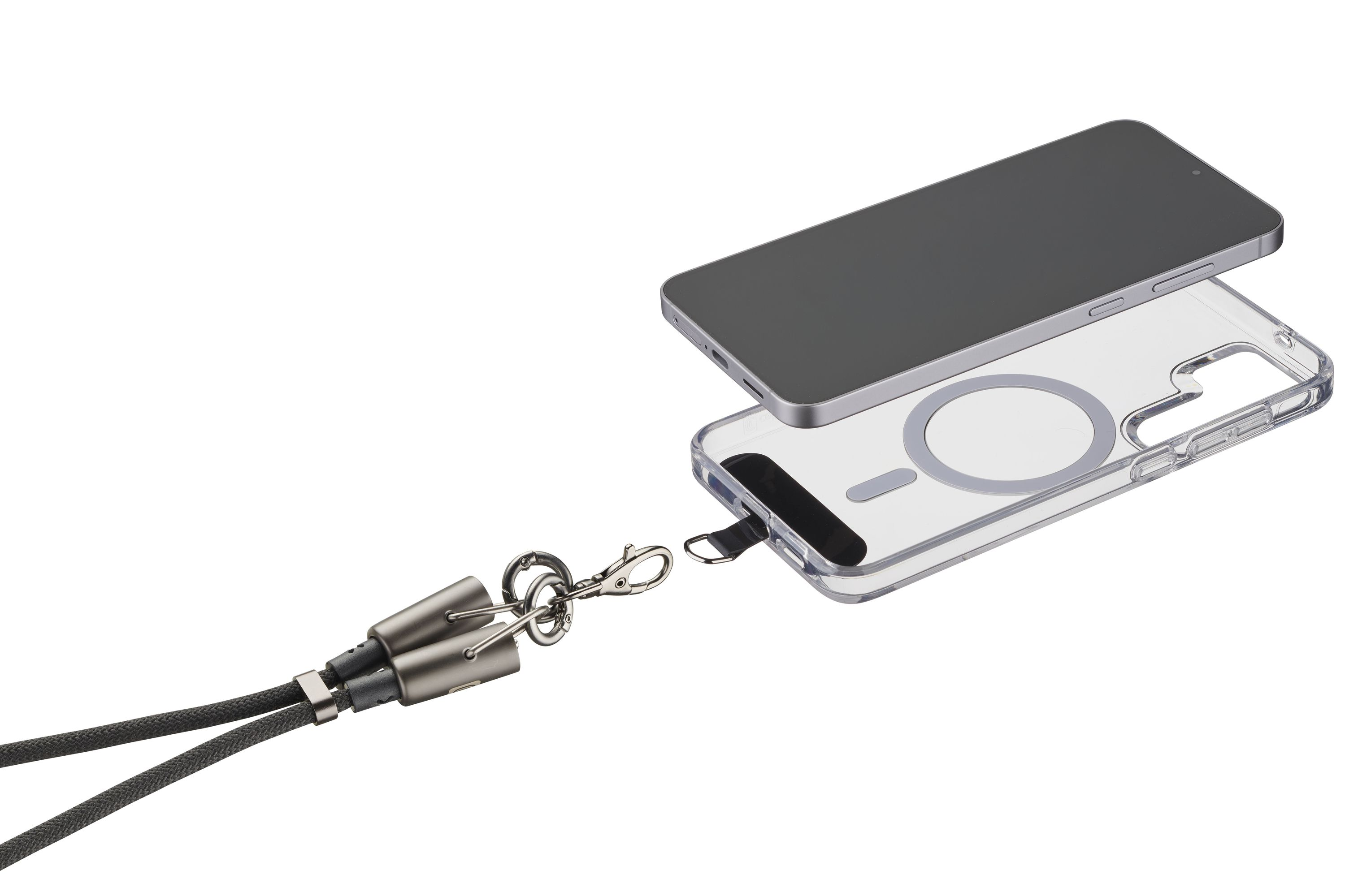 Mıknatıslı halka ve kordon bağlantılı şeffaf telefon kılıfı, yanında bir telefon.