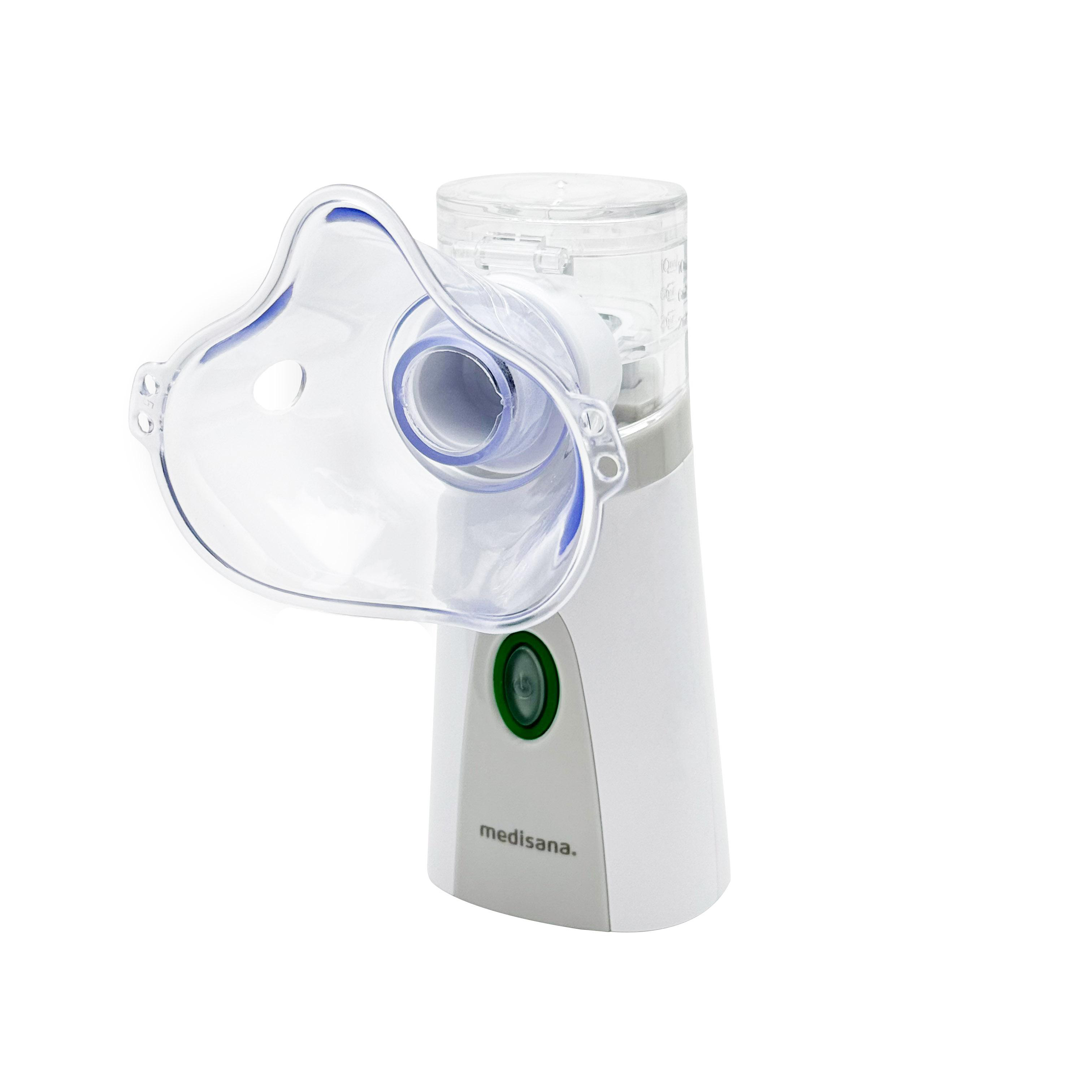 Ein weißer Vernebler mit transparenter Maske und grünem Knopf.