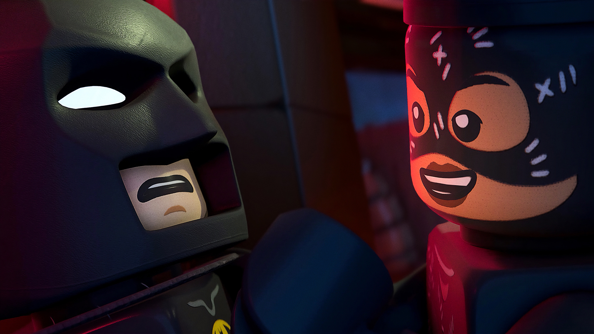 Lego Batman und Catwoman stehen sich gegenüber. Batman trägt einen schwarzen Umhang.