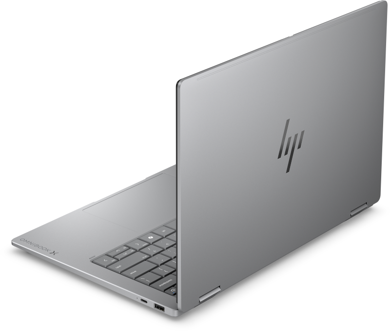 Gümüş renkli HP Omnibook X dizüstü bilgisayar açık, klavyesi ve HP logosu görünüyor.