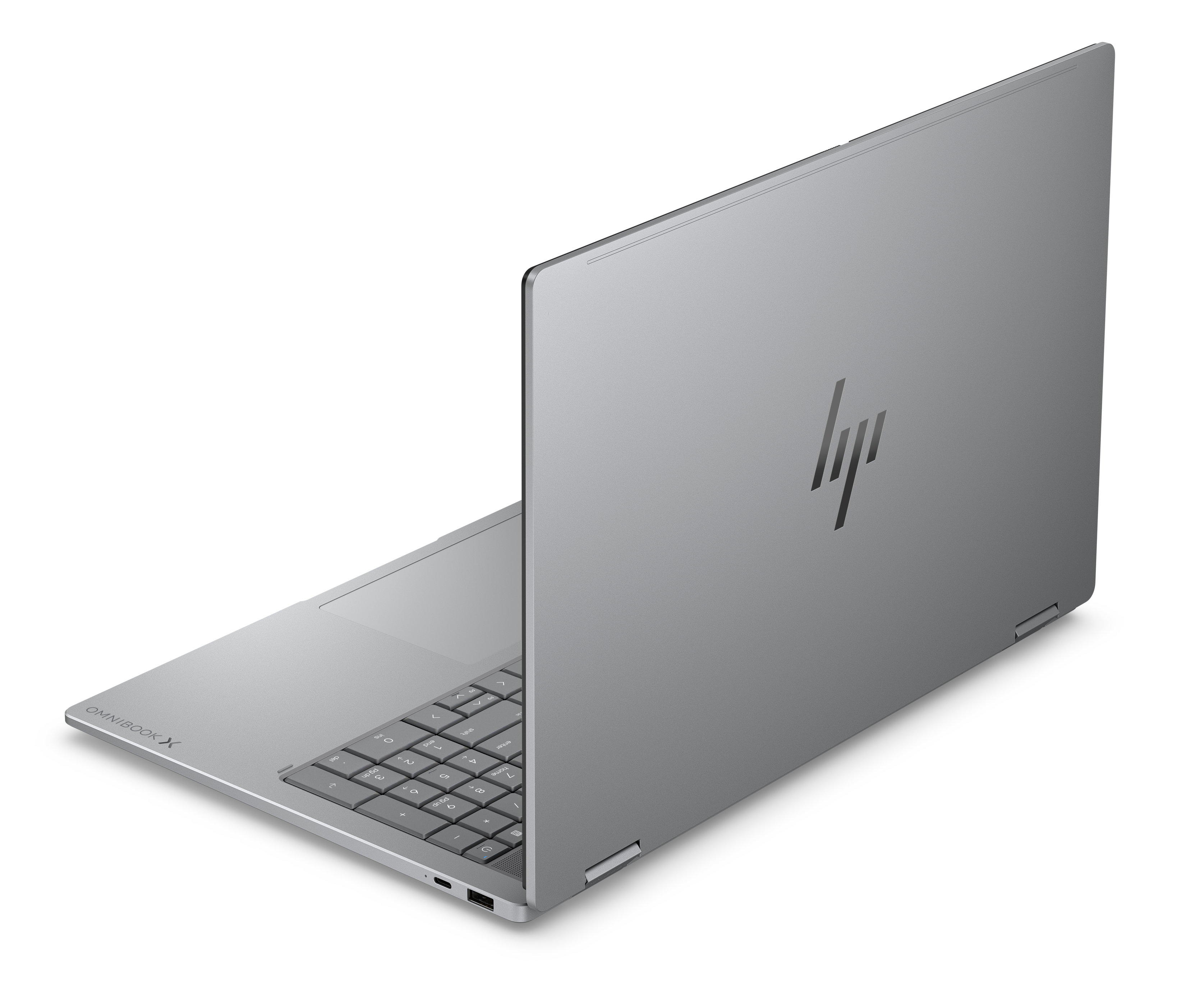 Ein silberner HP Omnibook Laptop mit beleuchteter Tastatur und HP-Logo.