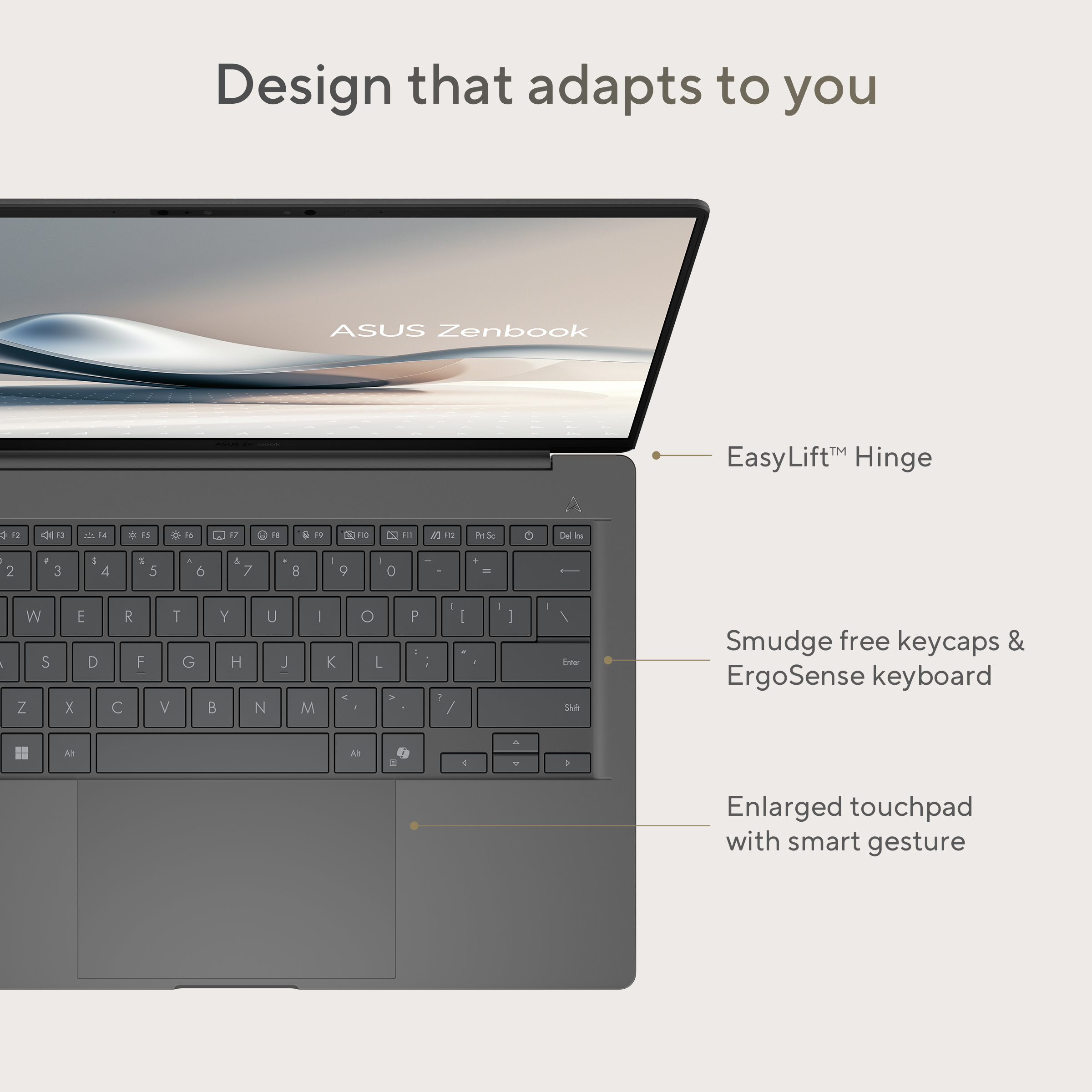 Een grijze ASUS Zenbook laptop met open scherm, die het toetsenbord en touchpad toont.