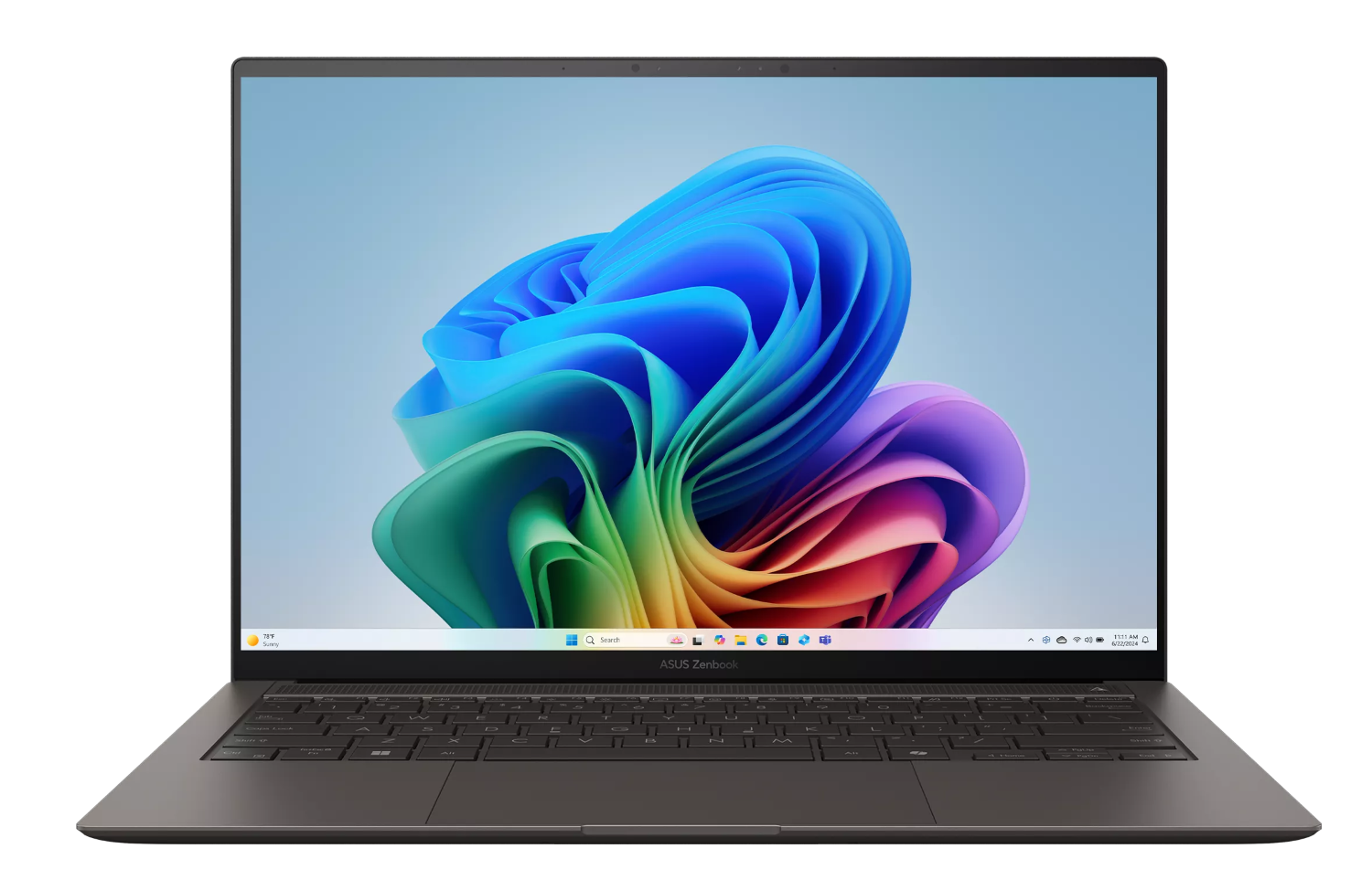 Otwarty laptop z kolorową tapetą Windows i klawiaturą.