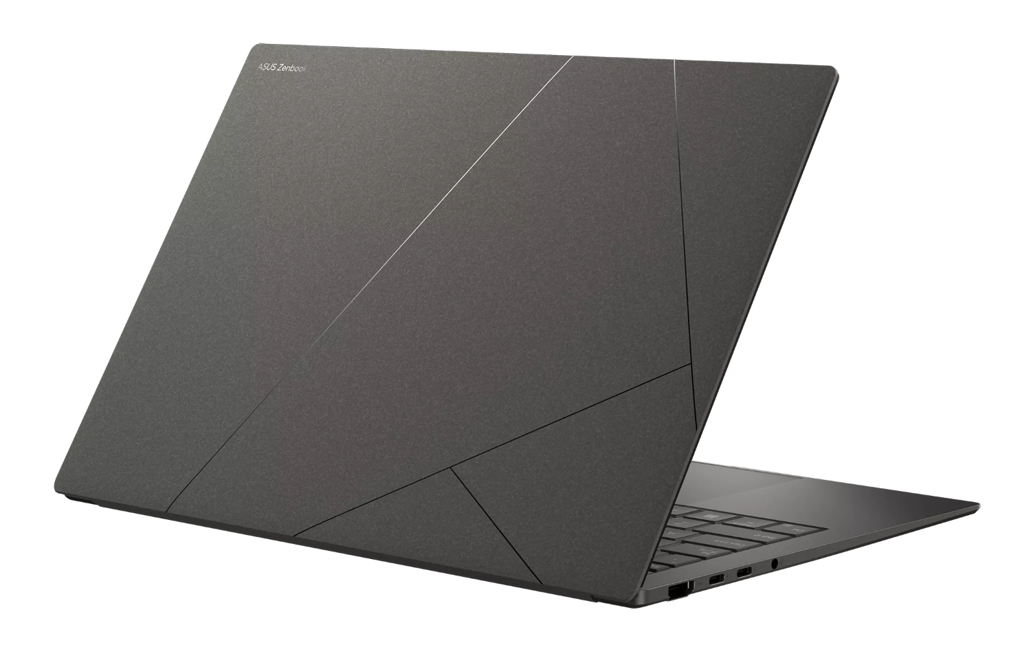 Zamknięty, ciemny laptop ze srebrnymi liniami na obudowie.