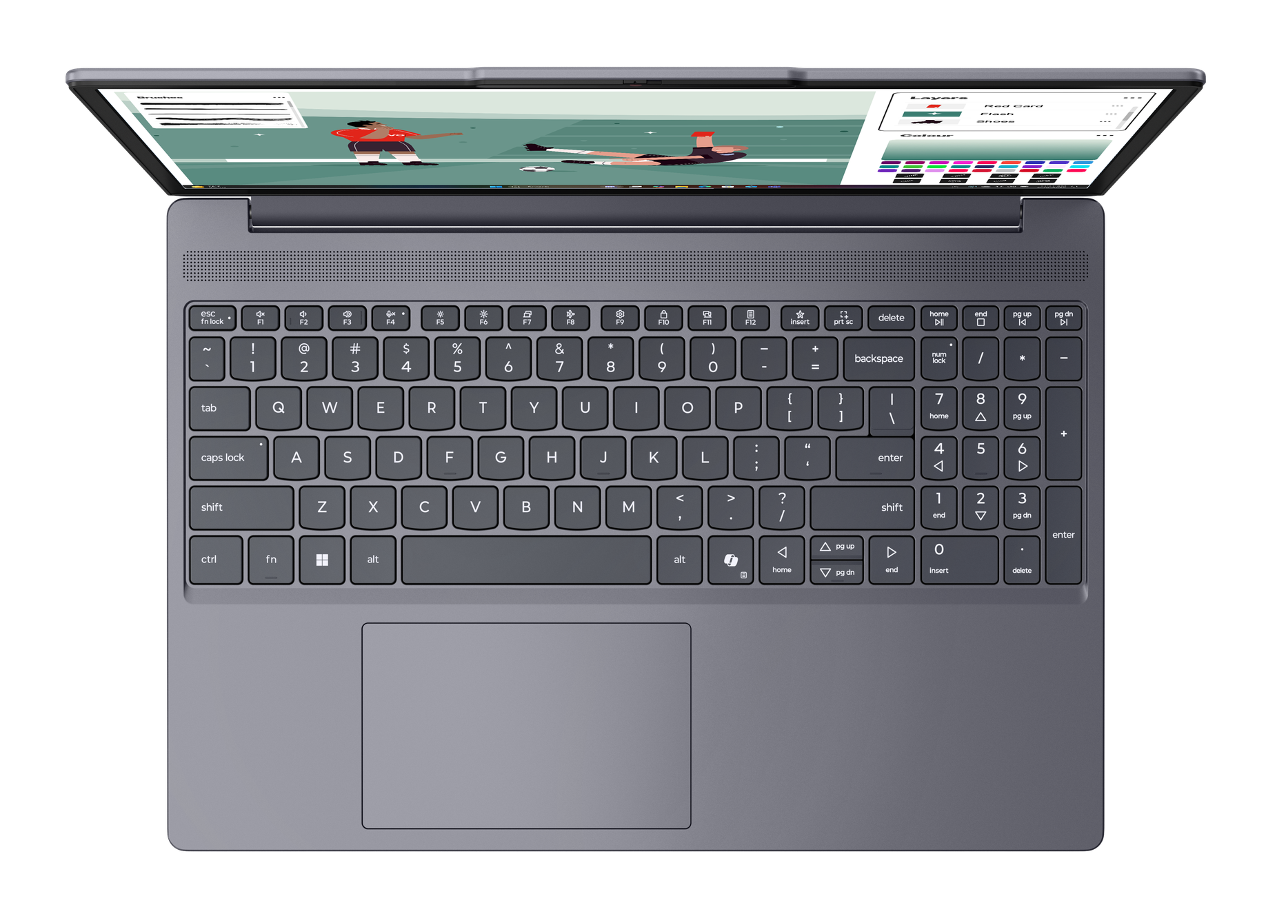 Laptop z otwartym ekranem, wyświetla mecz piłki nożnej. Klawiatura widoczna.