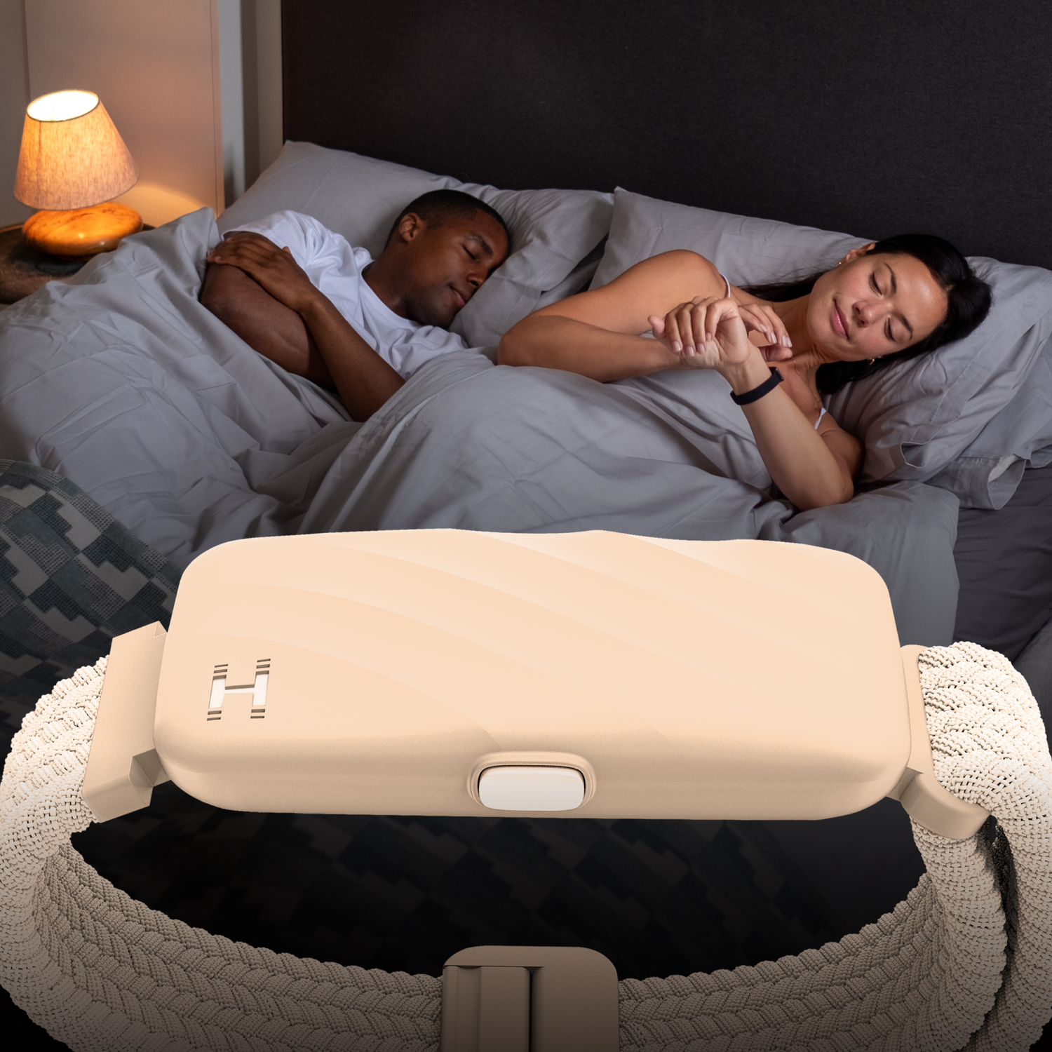 A man and woman sleep in bed, with a band in the foreground.