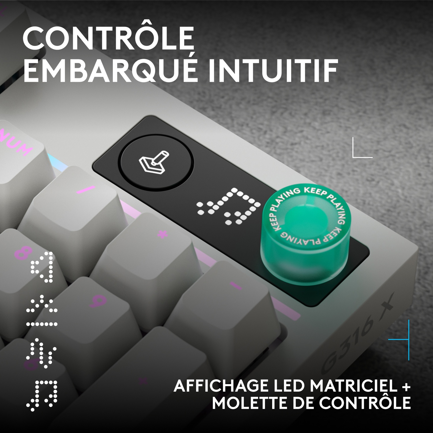 Clavier gris axé sur la molette de commande et un rouleau vert.