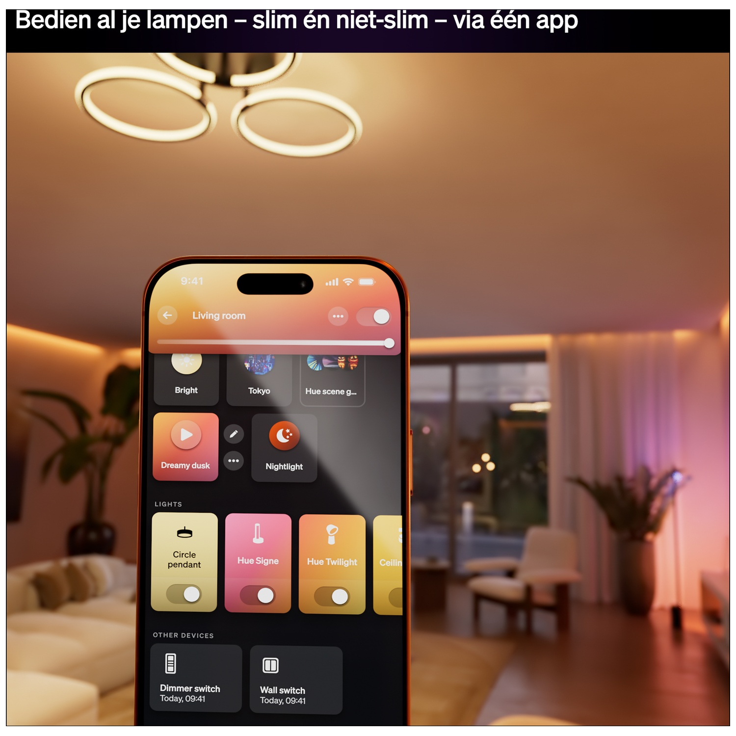 A smartphone displays a light control app in a living room with a ceiling fixture.
