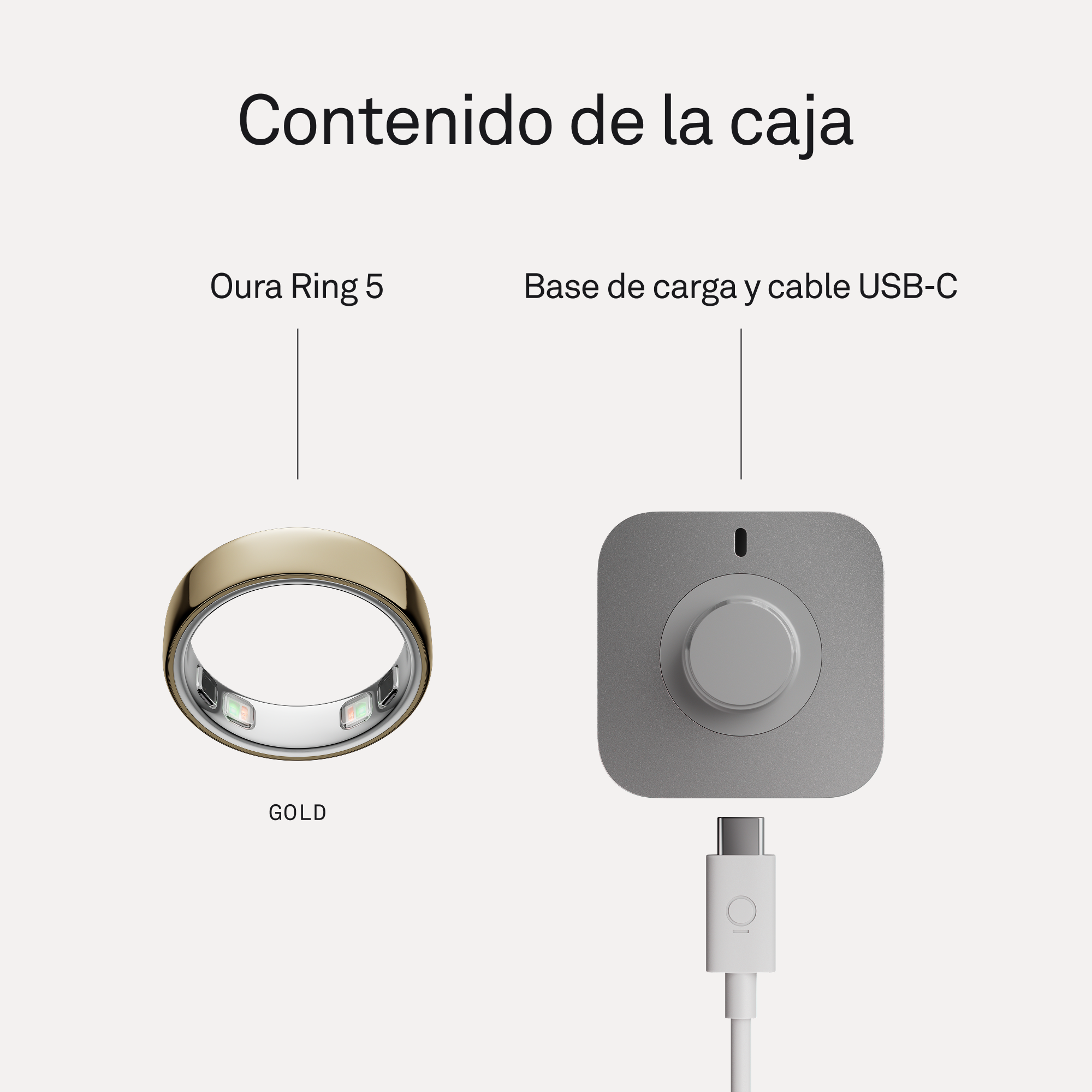 Un anillo Oura 5 dorado junto a una base de carga gris con cable USB-C.
