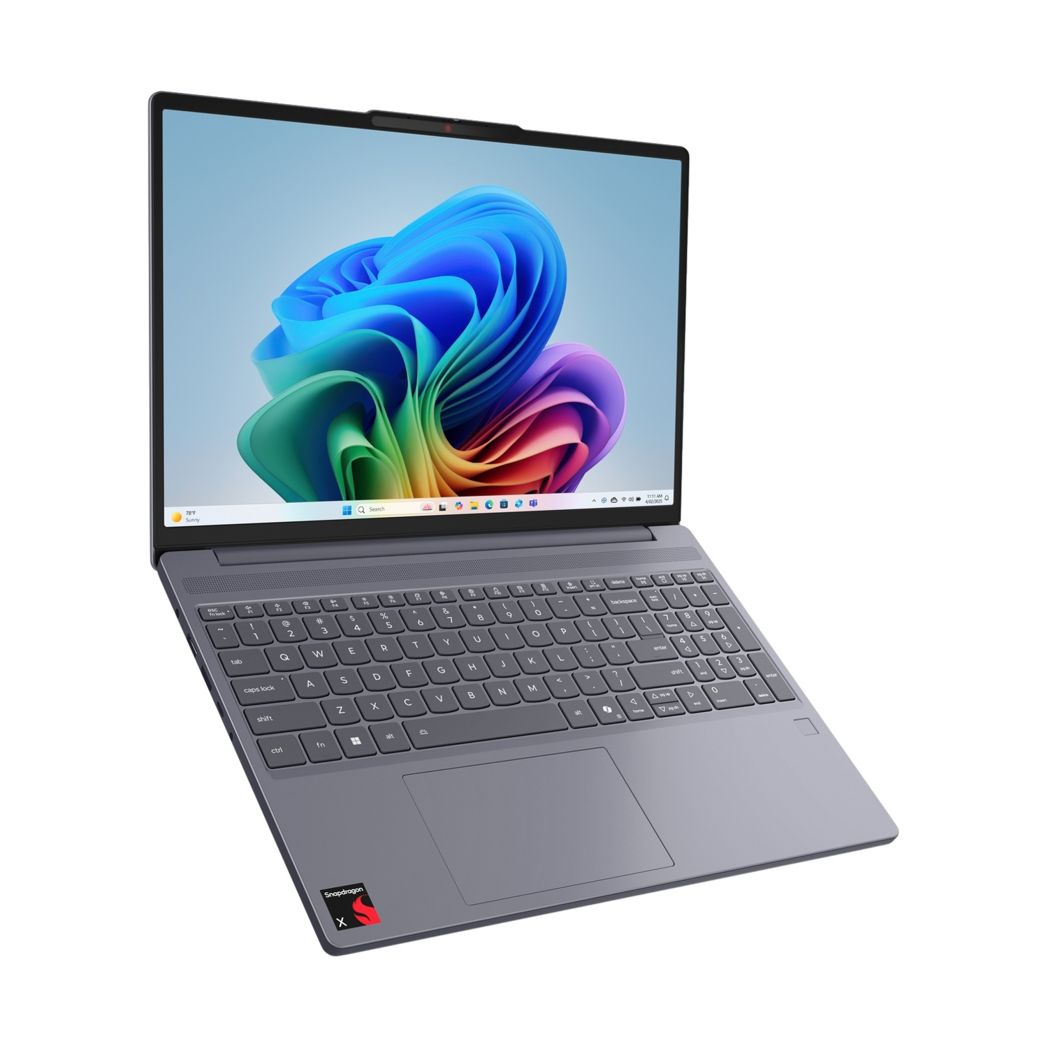 Un laptop grigio chiuso che visualizza uno sfondo colorato sullo schermo.