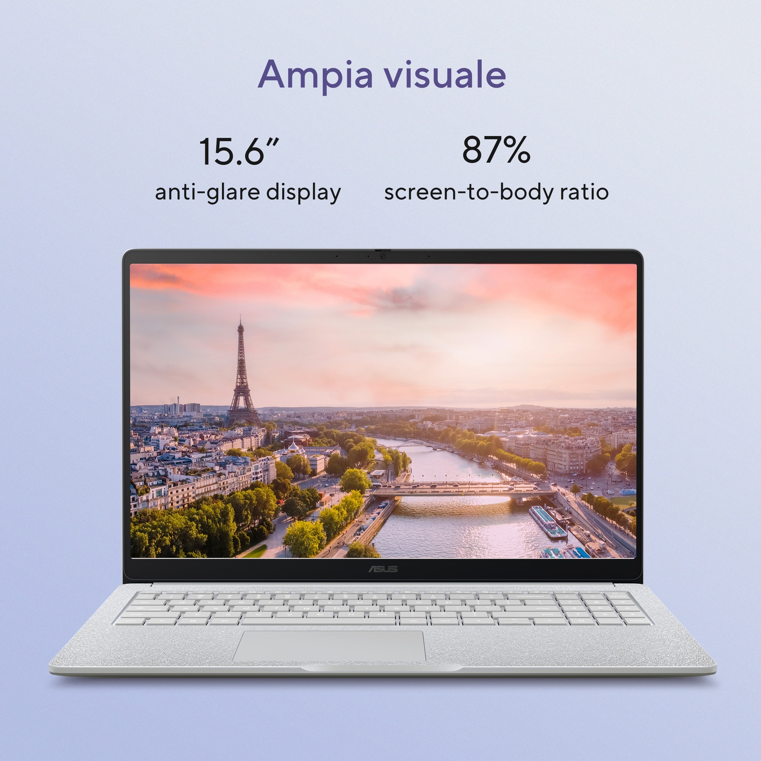 Un laptop con schermo antiriflesso da 15,6" mostra Parigi con la Torre Eiffel. Rapporto schermo-corpo 87%.
