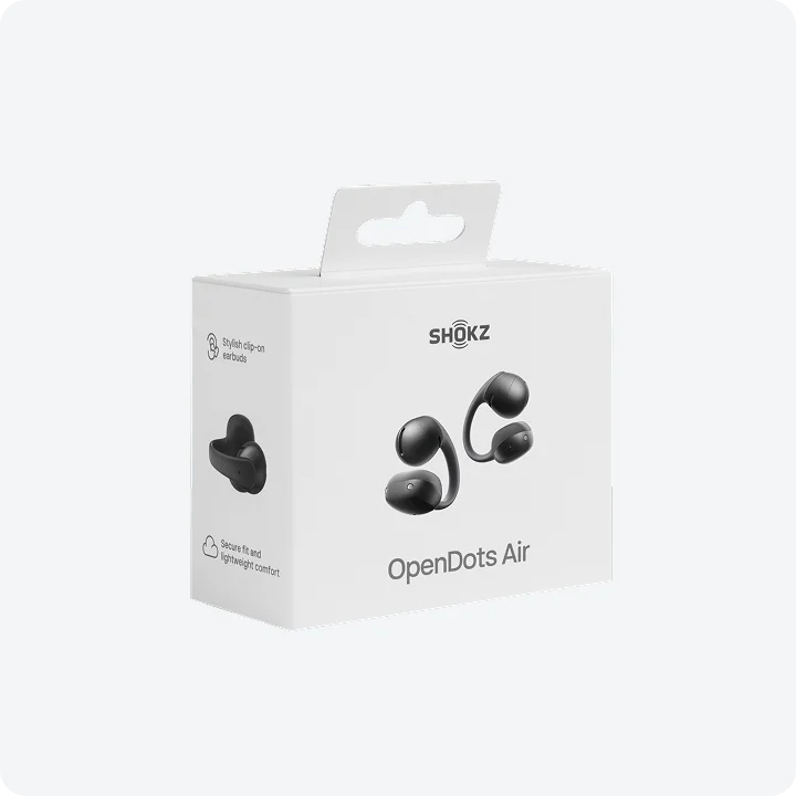 Białe pudełko SHOKZ OpenDots Air z czarnymi słuchawkami. Klips.