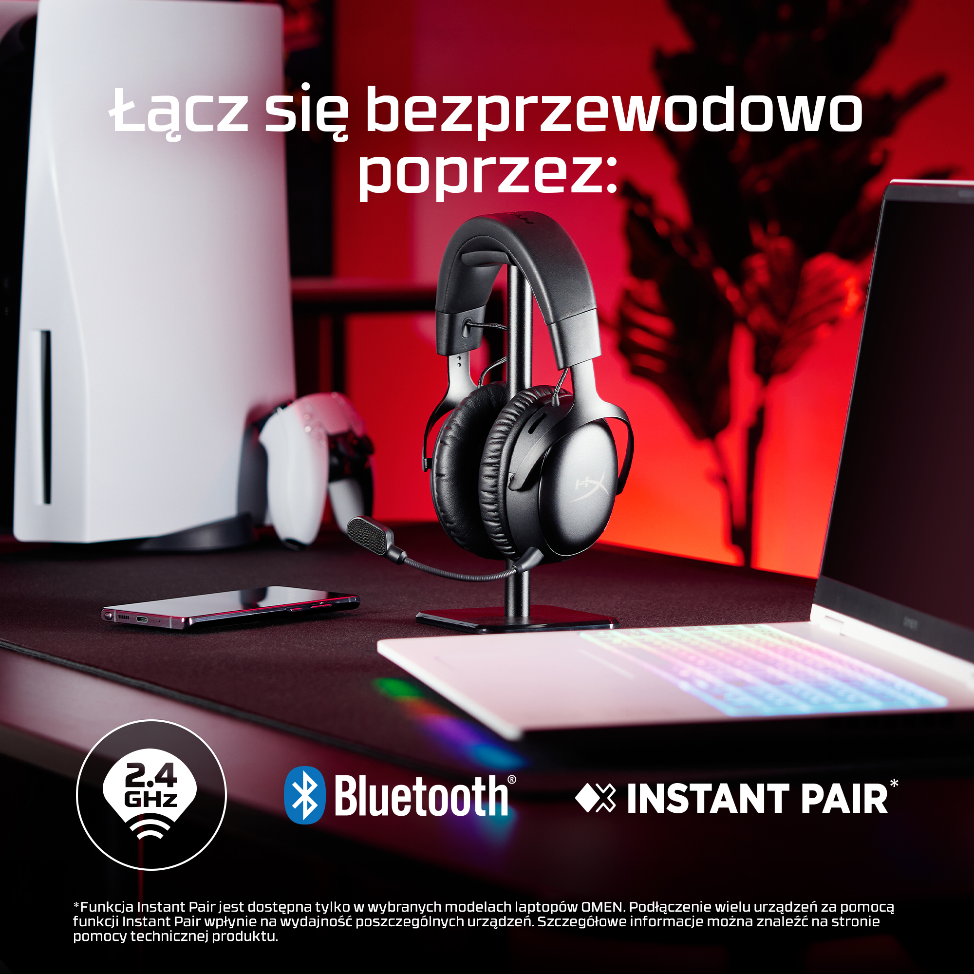Słuchawki, smartfon, kontroler i konsola na biurku.