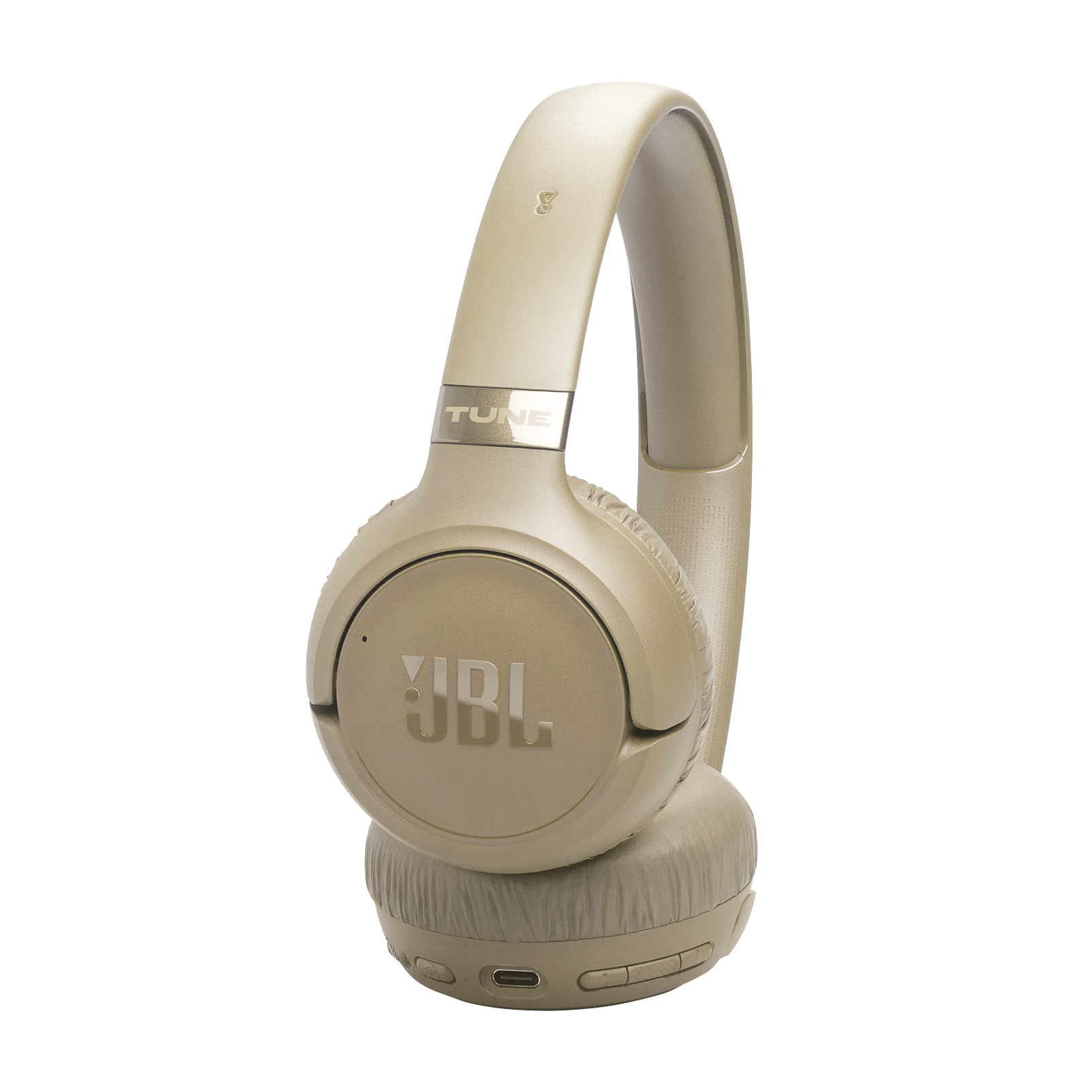 Beżowe słuchawki JBL Tune na czarnym tle. Widoczne logo JBL.