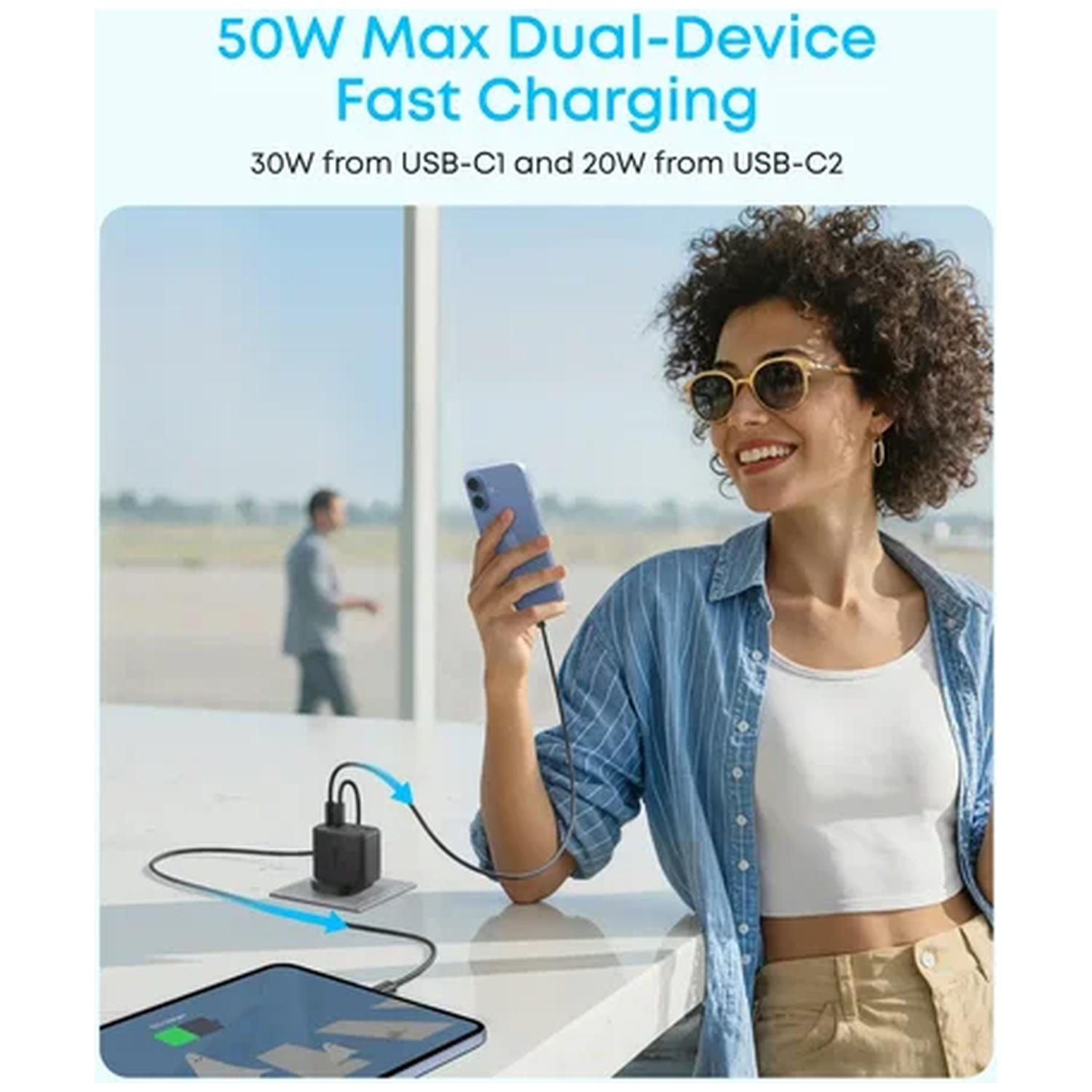 A woman charges her phone and tablet with a power adapter.