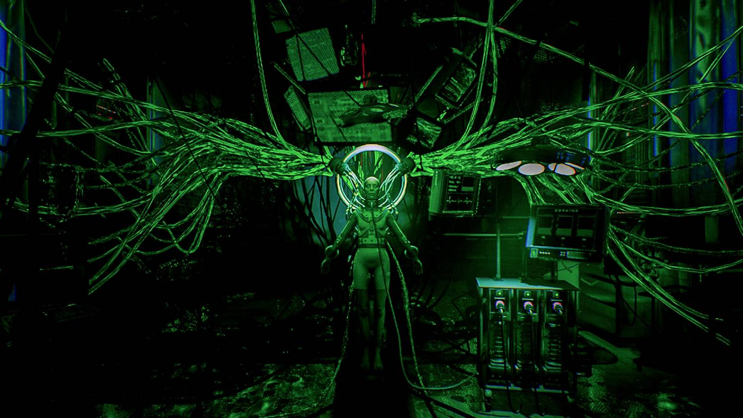 Una figura en una sala cableada con cables verdes y pantallas.