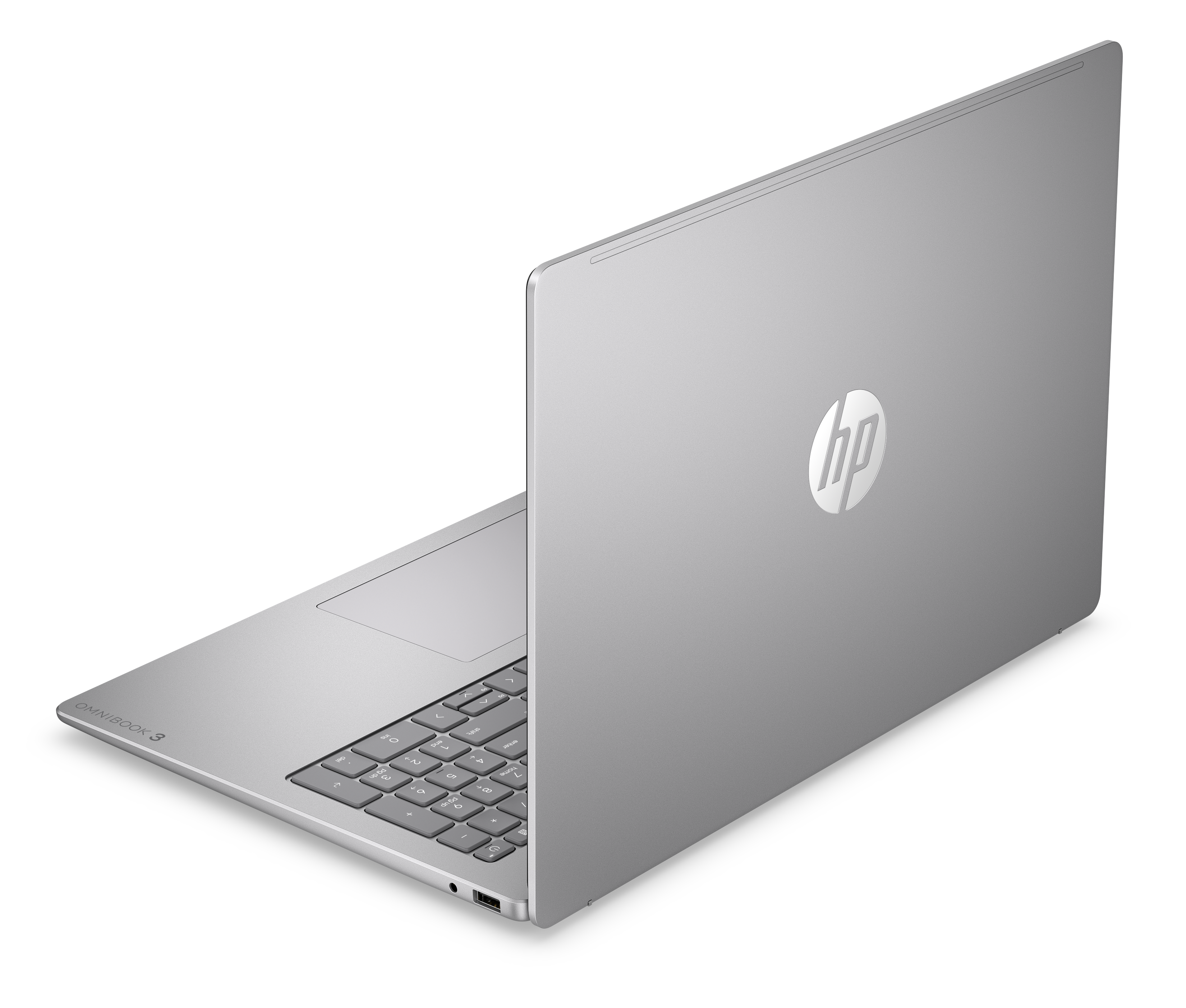 Ein silberner HP Omnibook 3 Laptop im Profil auf schwarzem Hintergrund.