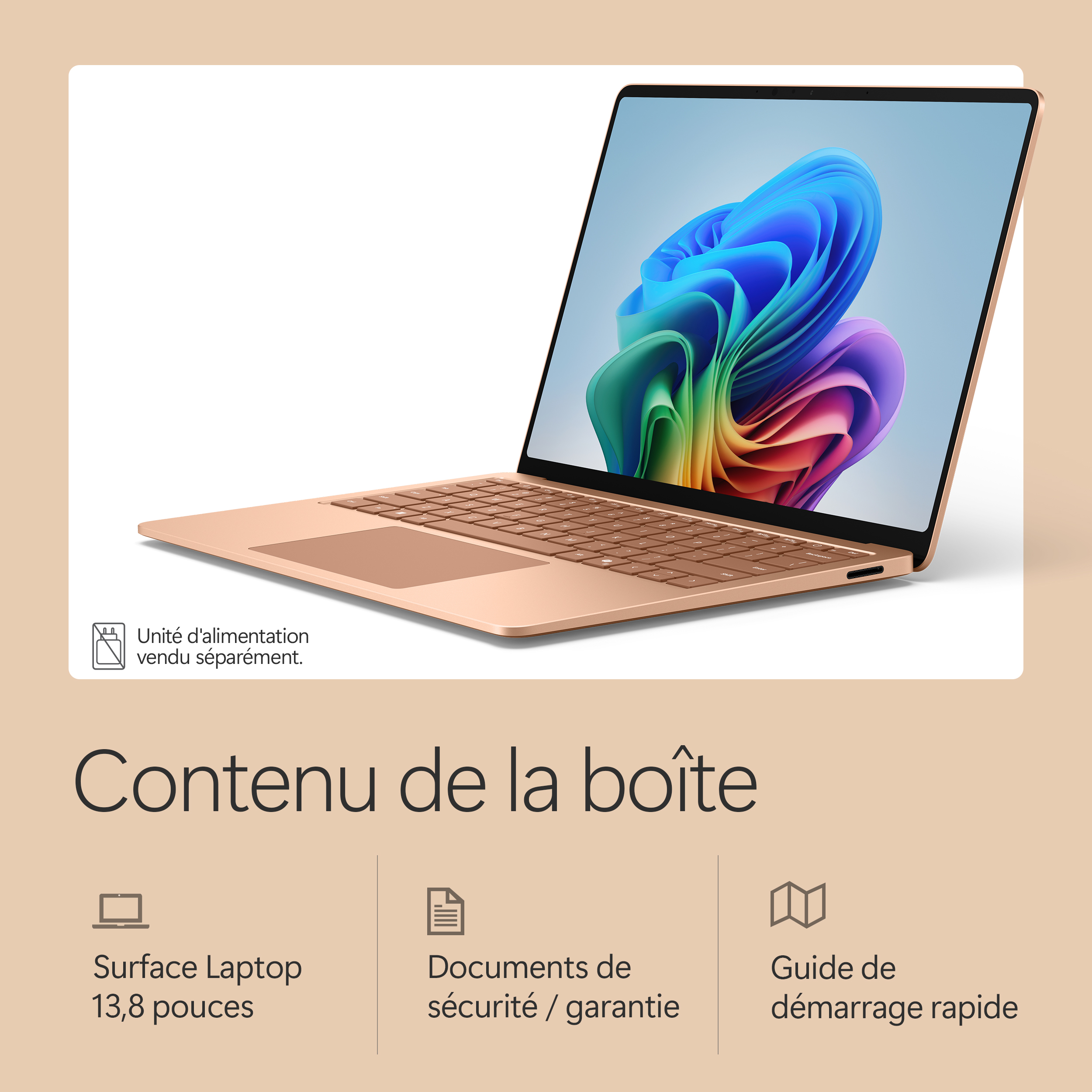 Un ordinateur portable or rose avec un écran coloré et note sur adaptateur secteur.