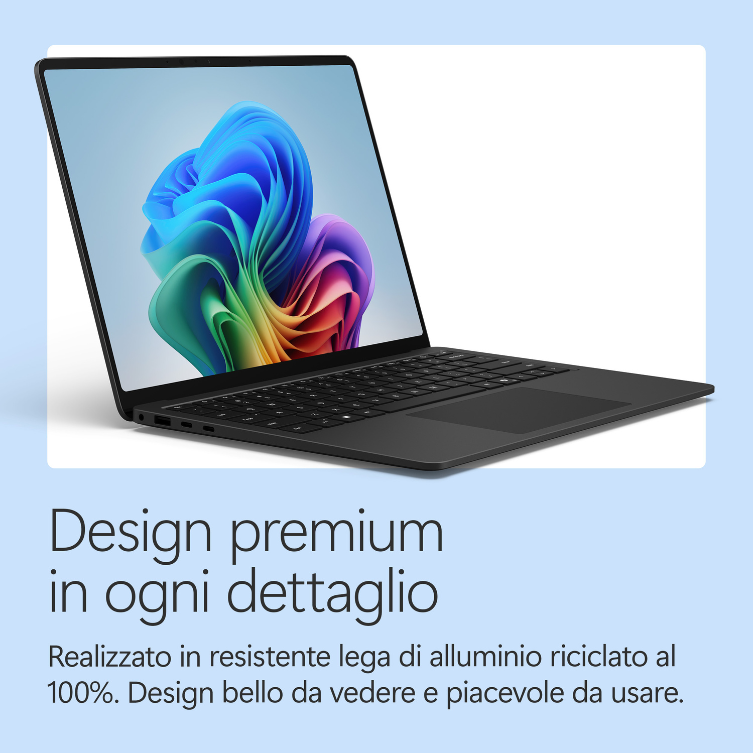 Un laptop nero con uno sfondo astratto colorato sullo schermo.