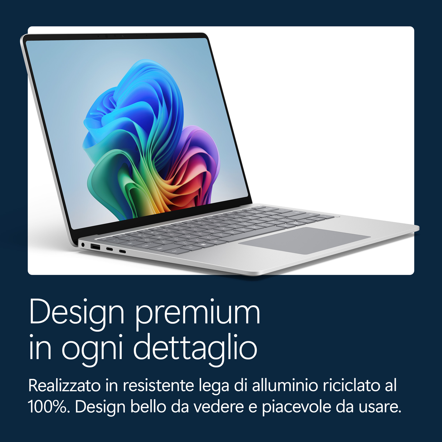 Un laptop argentato con uno sfondo colorato sullo schermo.