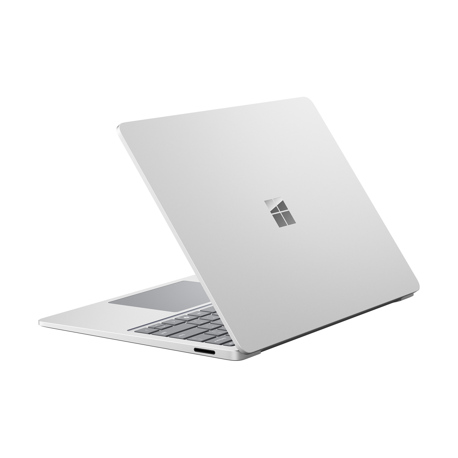 Un Microsoft Surface Laptop argentato è mostrato su sfondo bianco.