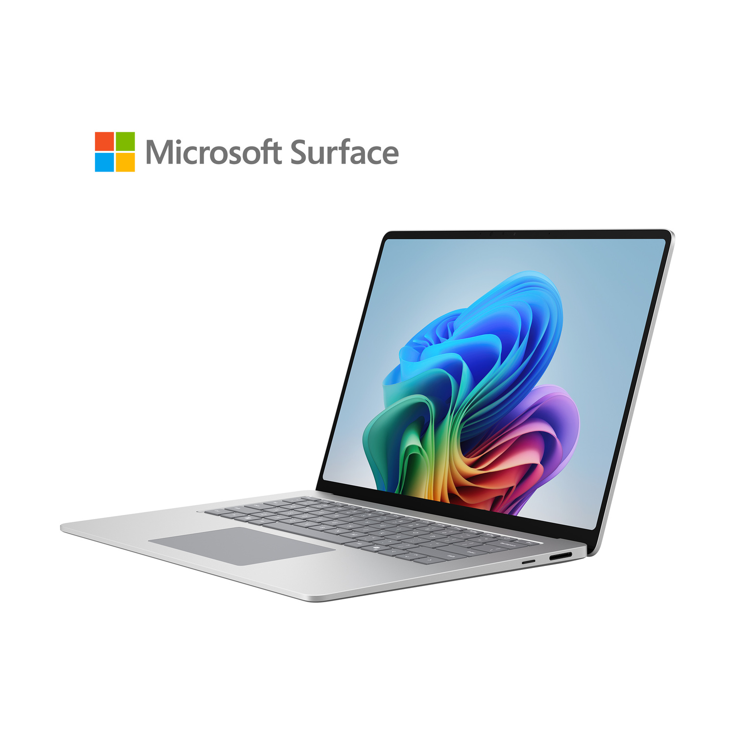 Un laptop Microsoft Surface argentato con uno sfondo astratto colorato sullo schermo.