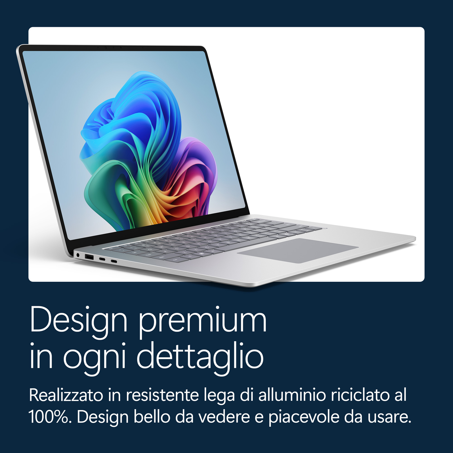 Un laptop argentato con uno sfondo colorato sullo schermo.