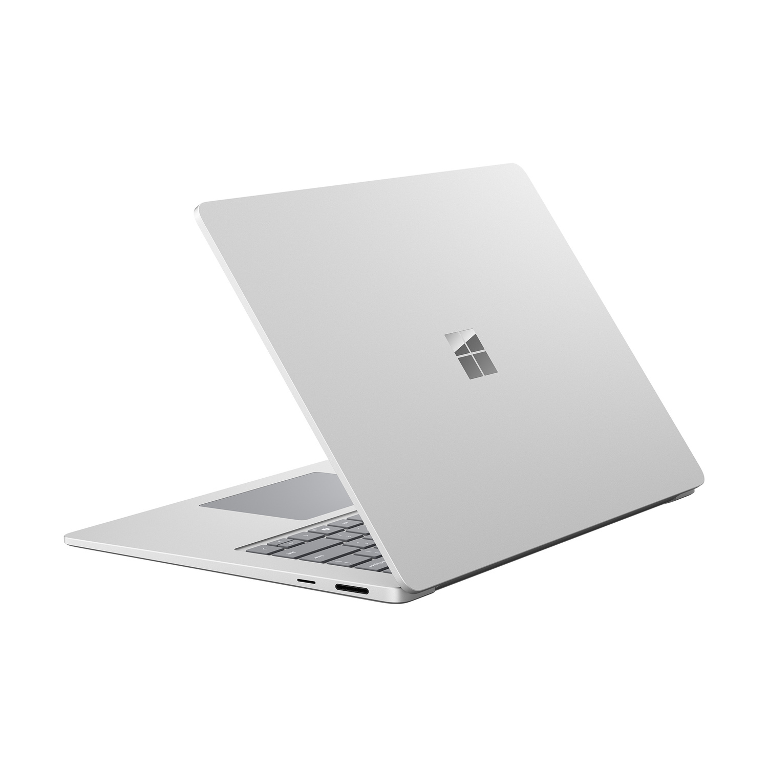 Un laptop argentato con il logo Microsoft sul coperchio, su sfondo bianco.