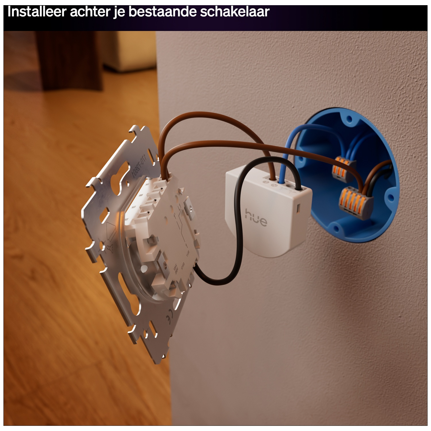 Un module d'interrupteur Hue est installé dans une boîte murale avec fils et connecteurs.