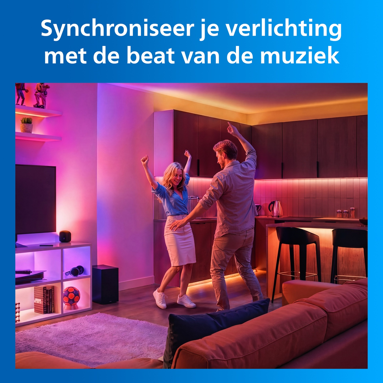 A couple dances in a living room with colorful lighting.