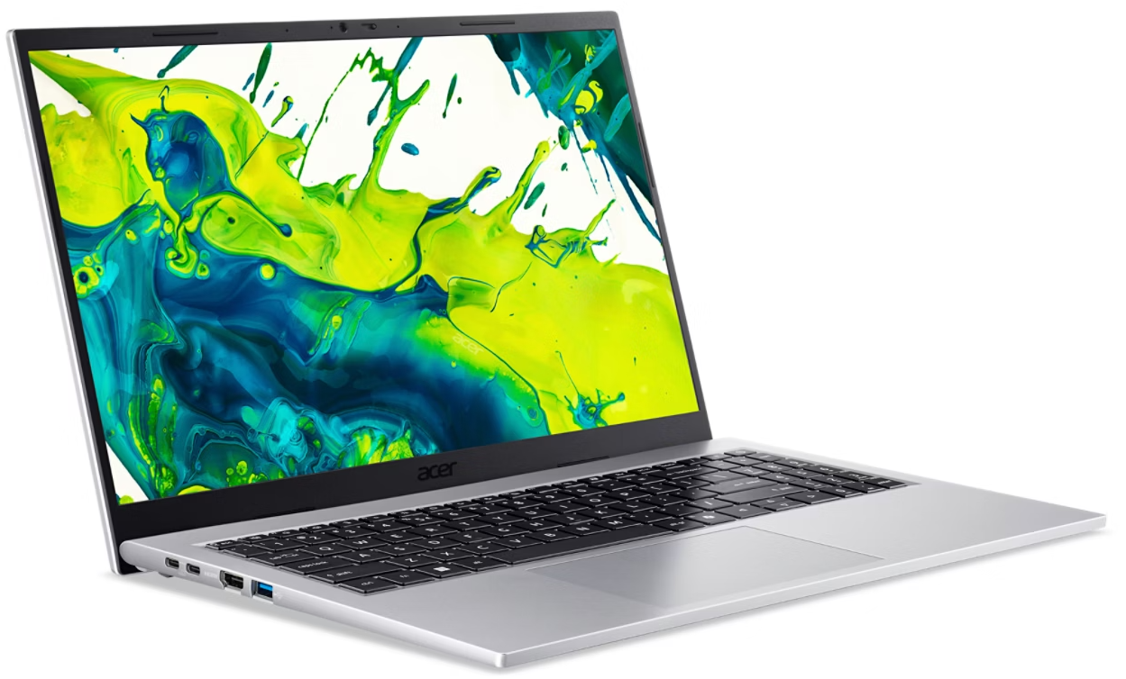 Egy nyitott ezüst laptop, színes, fröccsenő háttérképpel a képernyőn.