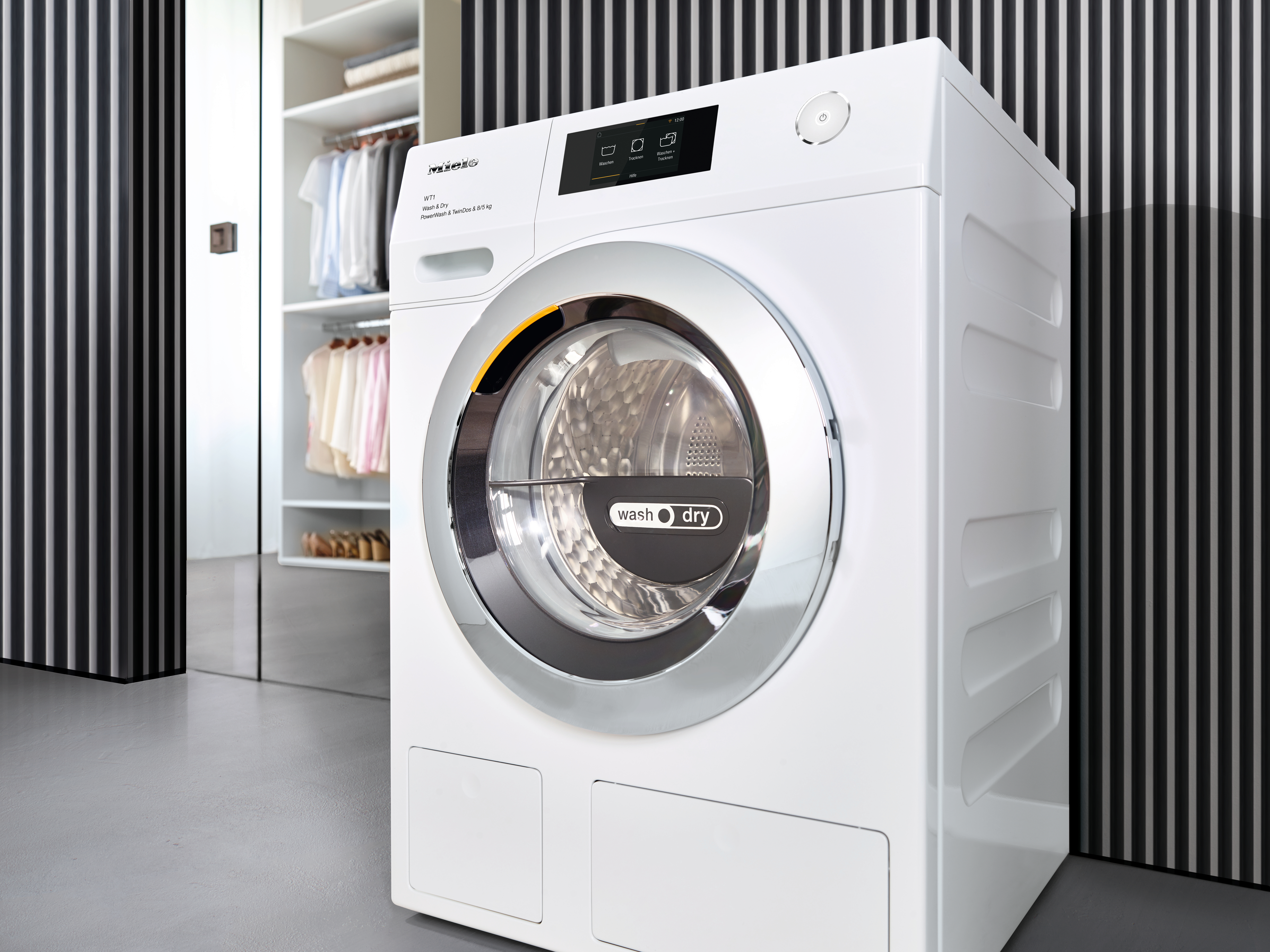Eine weiße Waschmaschine mit einem silbernen Rand und einem "wash dry"-Symbol.