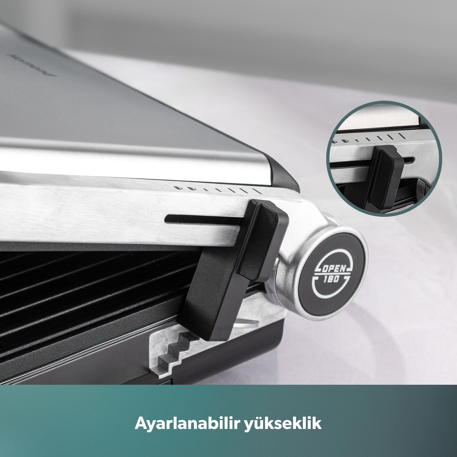 Gümüş renkli, siyah saplı ve ayarlanabilir yükseklik göstergeli kontaktlı ızgara.